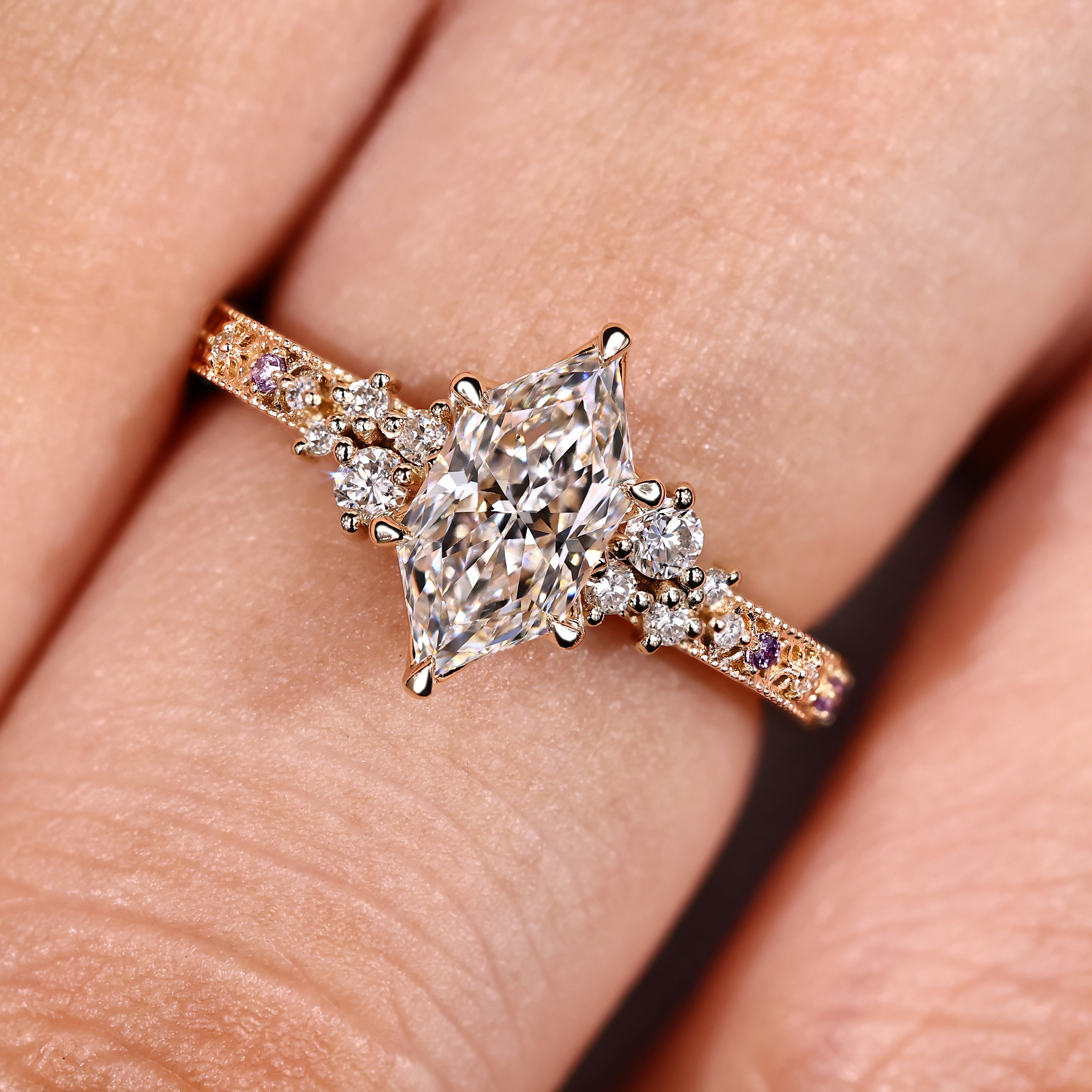 Dutch marquise ring featuring round amethyst accent stones and milgrain details