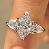 Dutch marquise diamond ring with pear side stones design.
