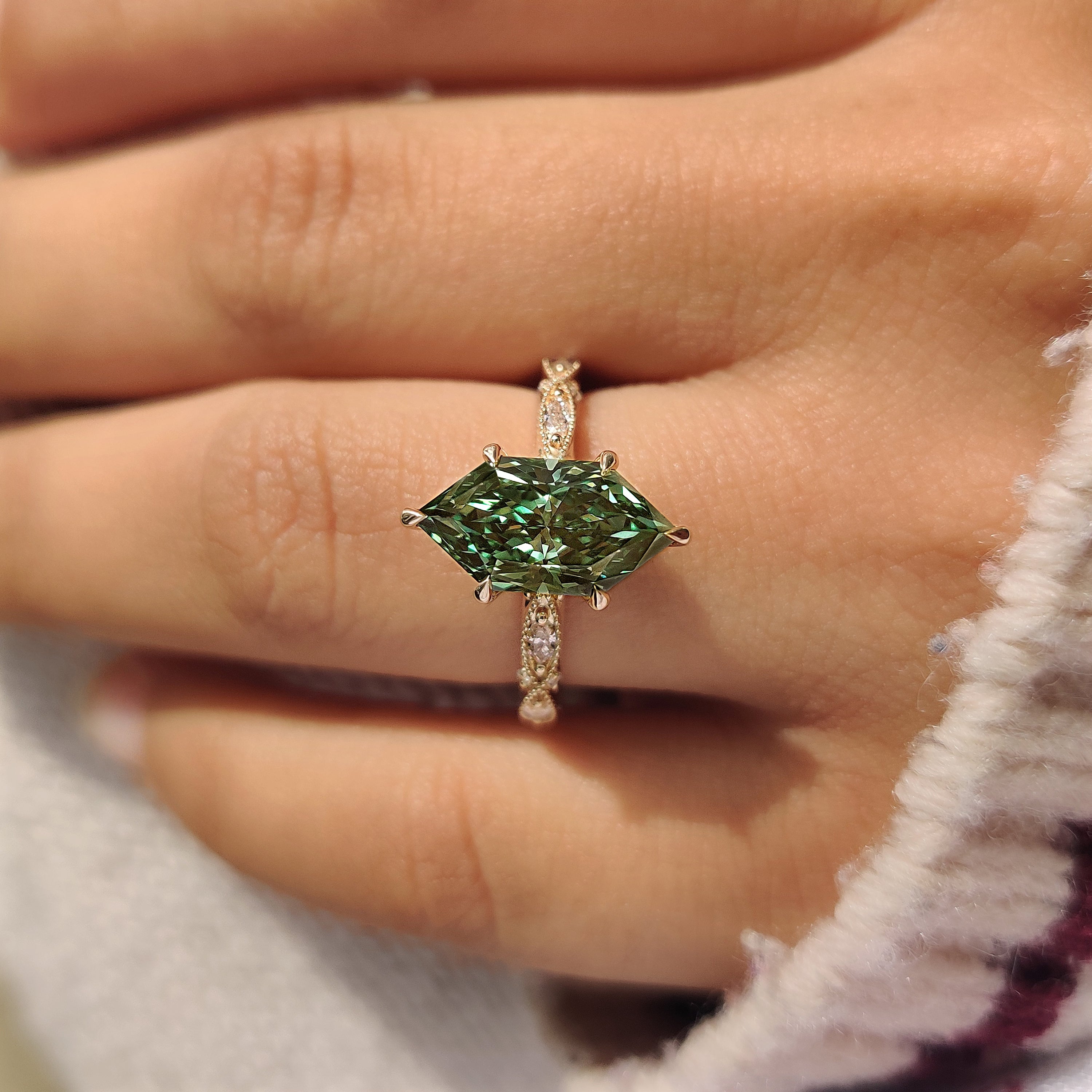 Green Dutch marquise engagement ring with six claw prong setting
