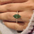 Green Dutch marquise engagement ring with six claw prong setting
