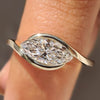 Marquise engagement ring with bypass setting
