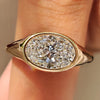 Oval diamond ring with east to west bezel setting
