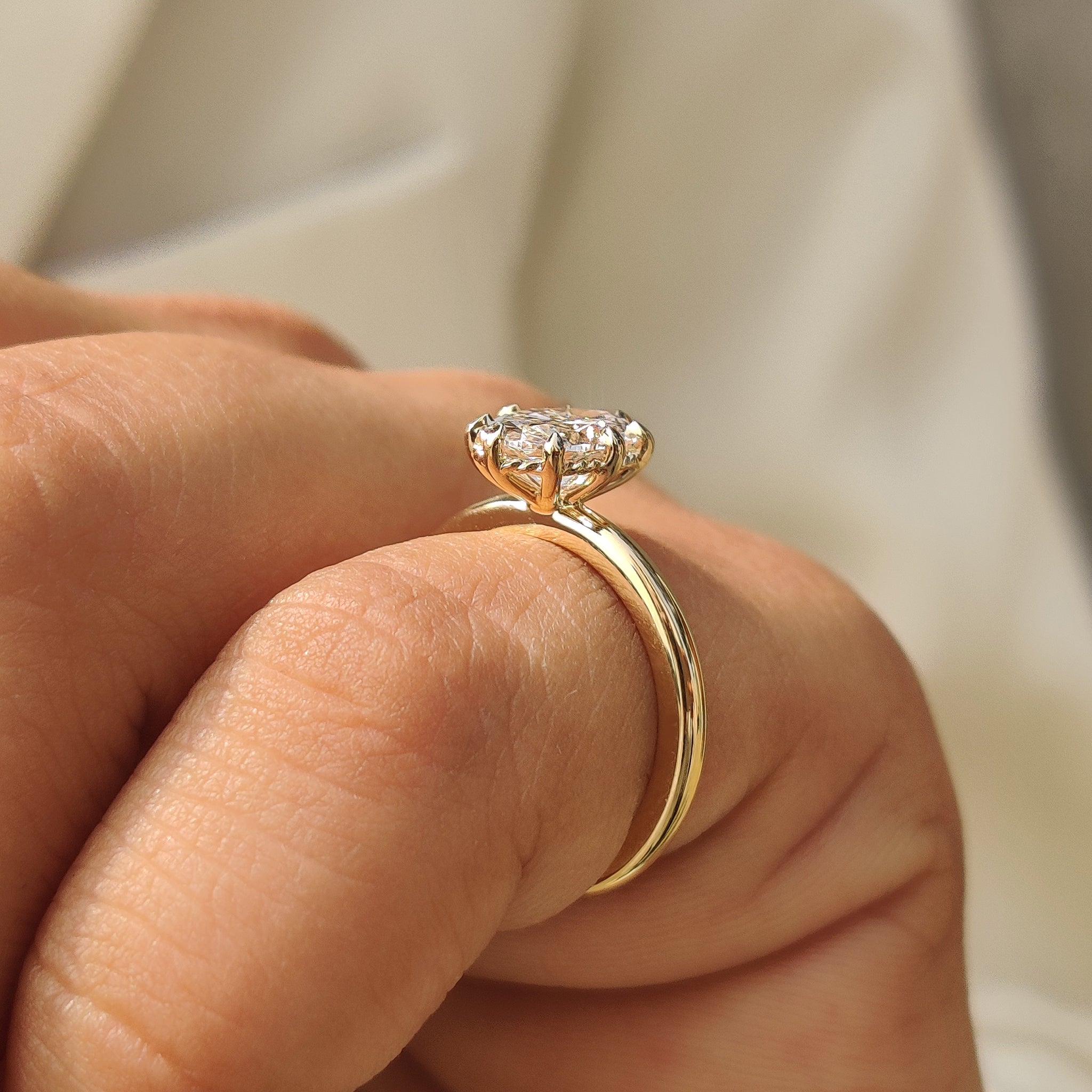 Oval engagement ring solitaire design with secure eight claw prong
