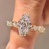 Elongated hexagon ring with baguette cut pave band design.
