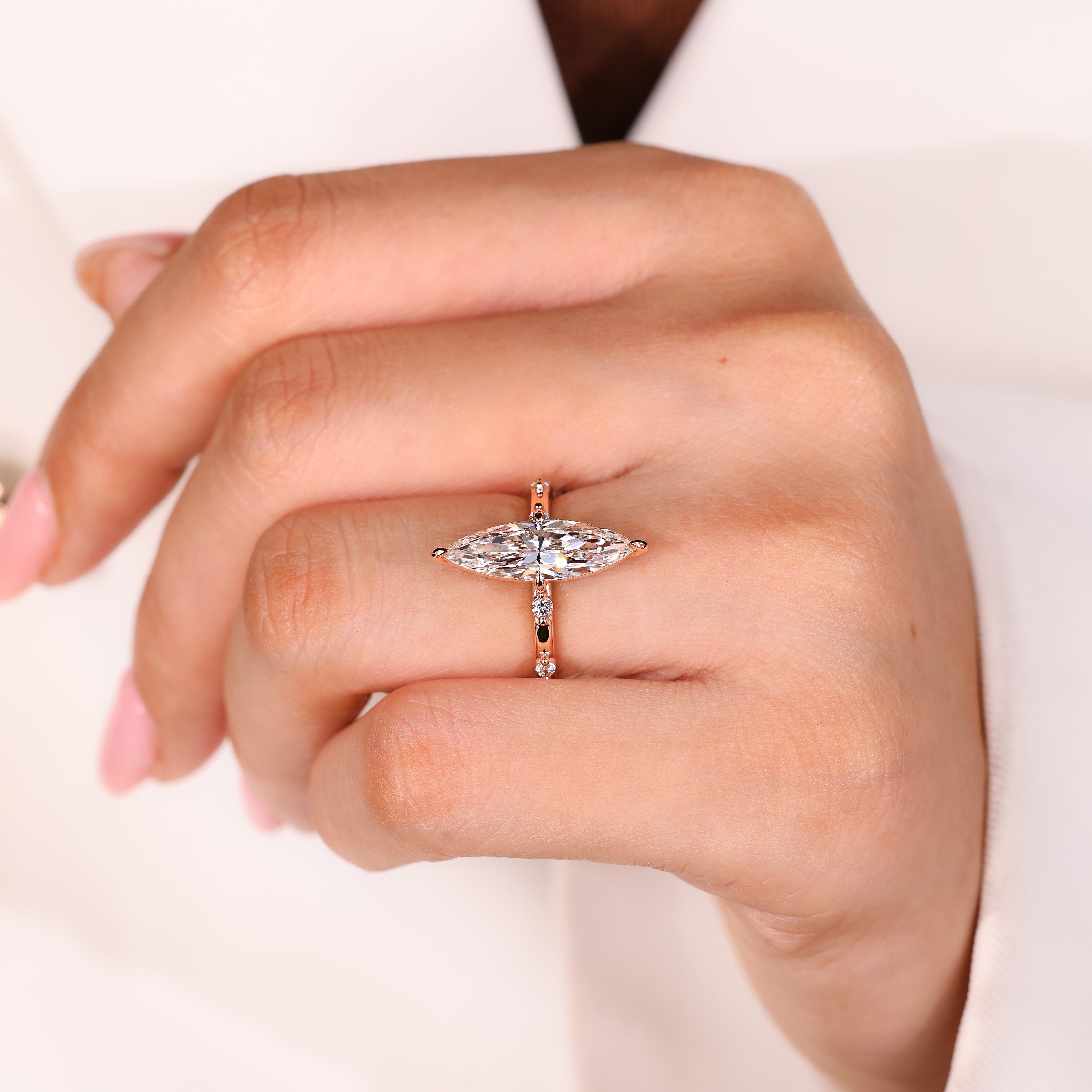 Handmade marquise engagement ring with distance pave design
