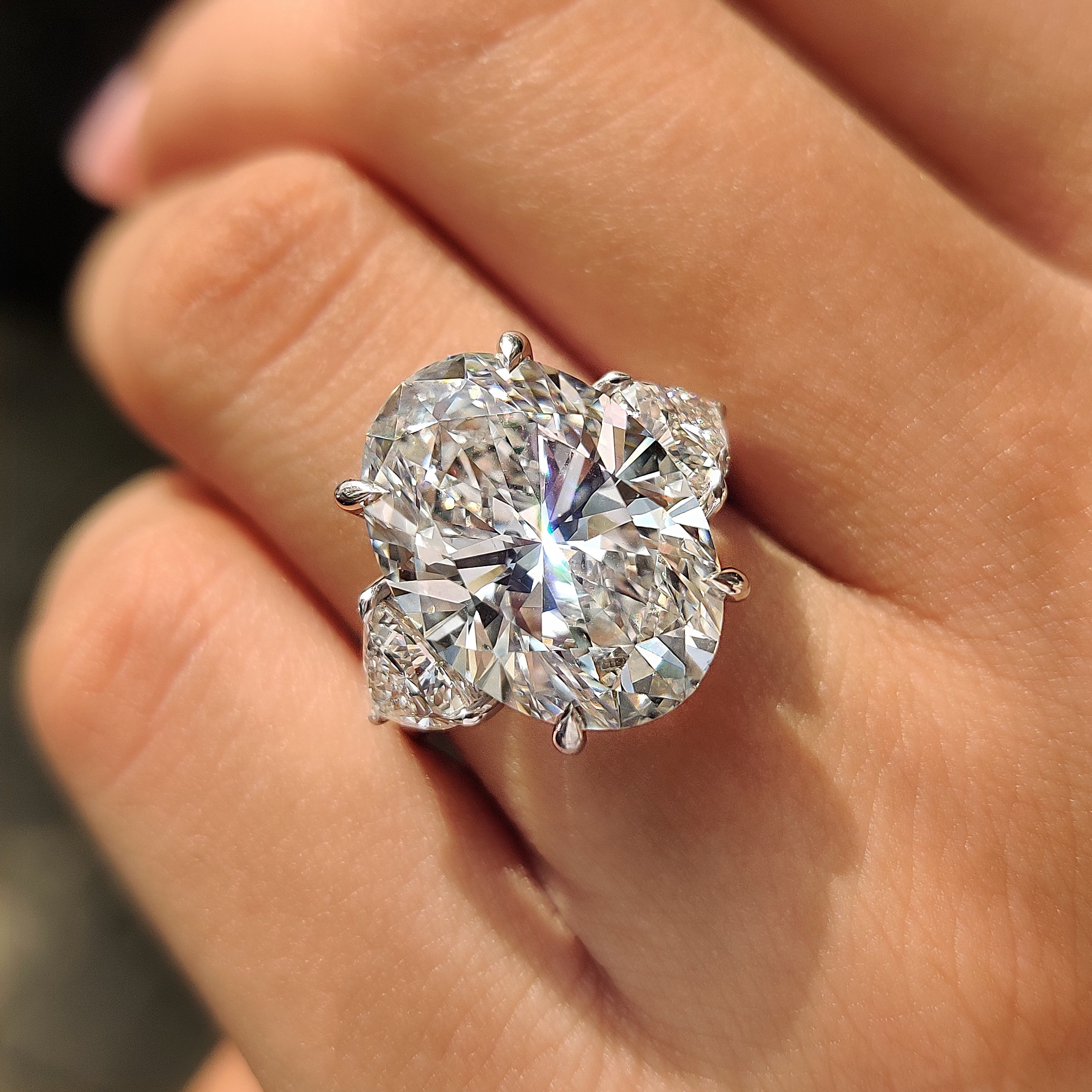 Oval diamond ring with detailed claw prong setting
