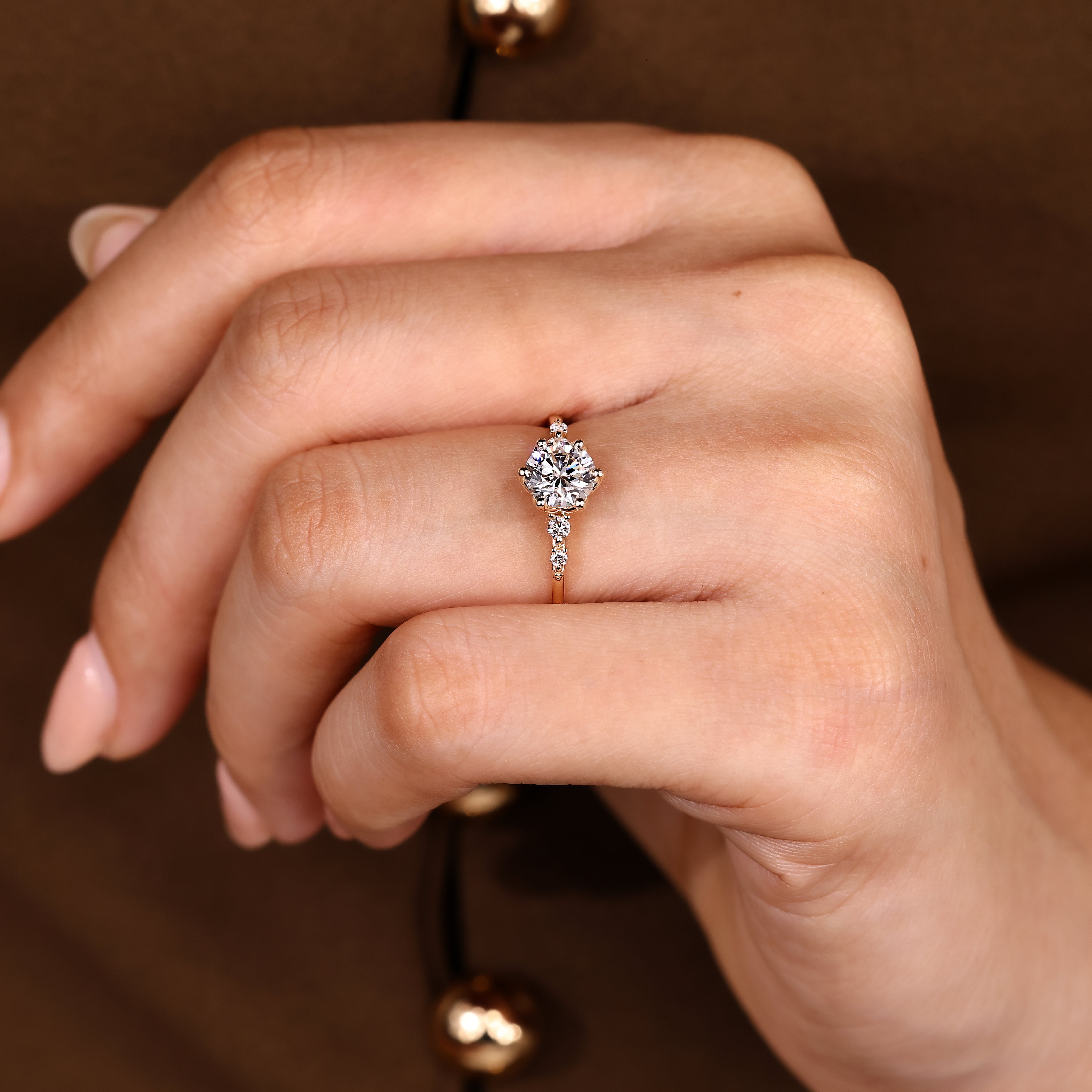 Round cut ring with five stone and tulip setting
