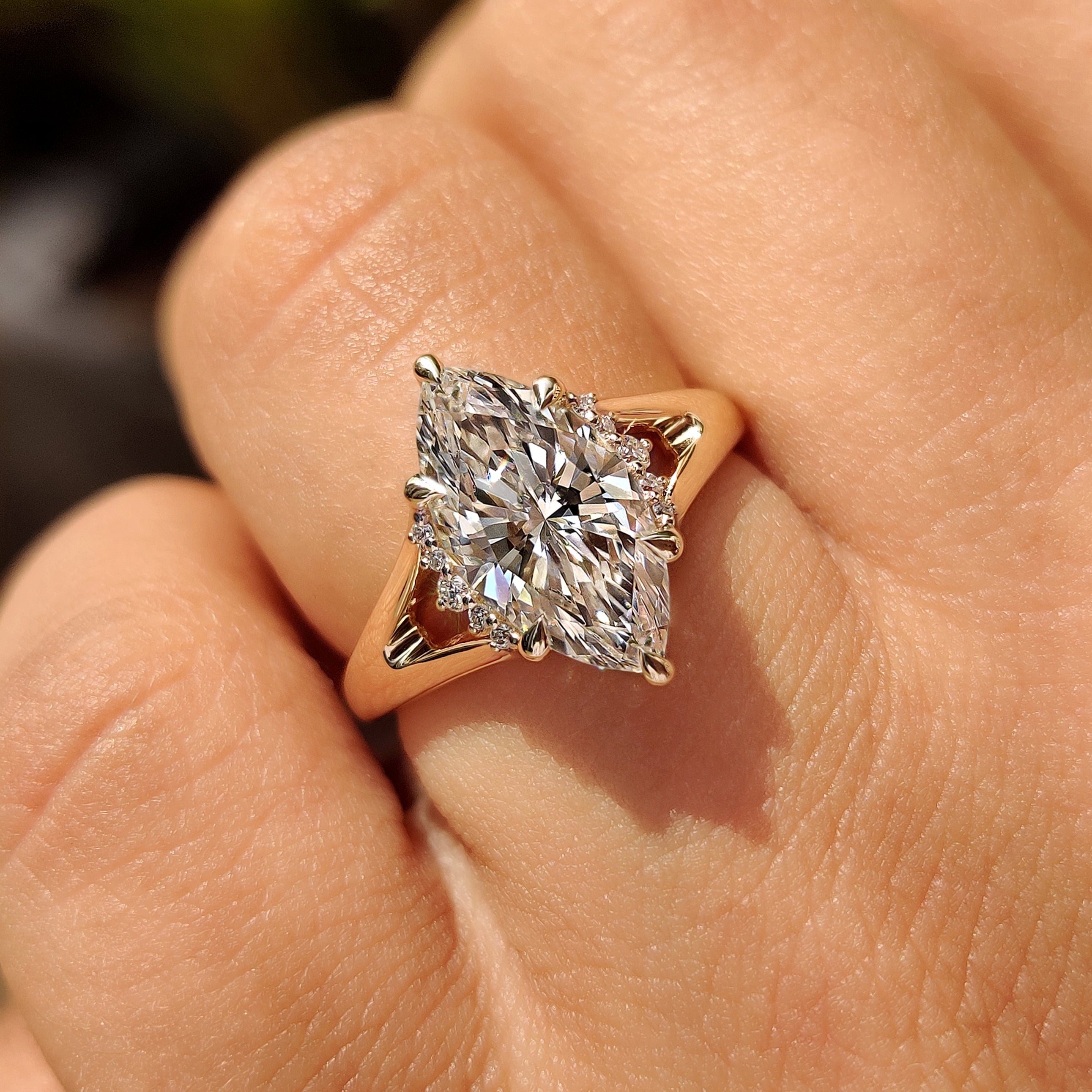 Marquise lab grown diamond ring with round accent stones
