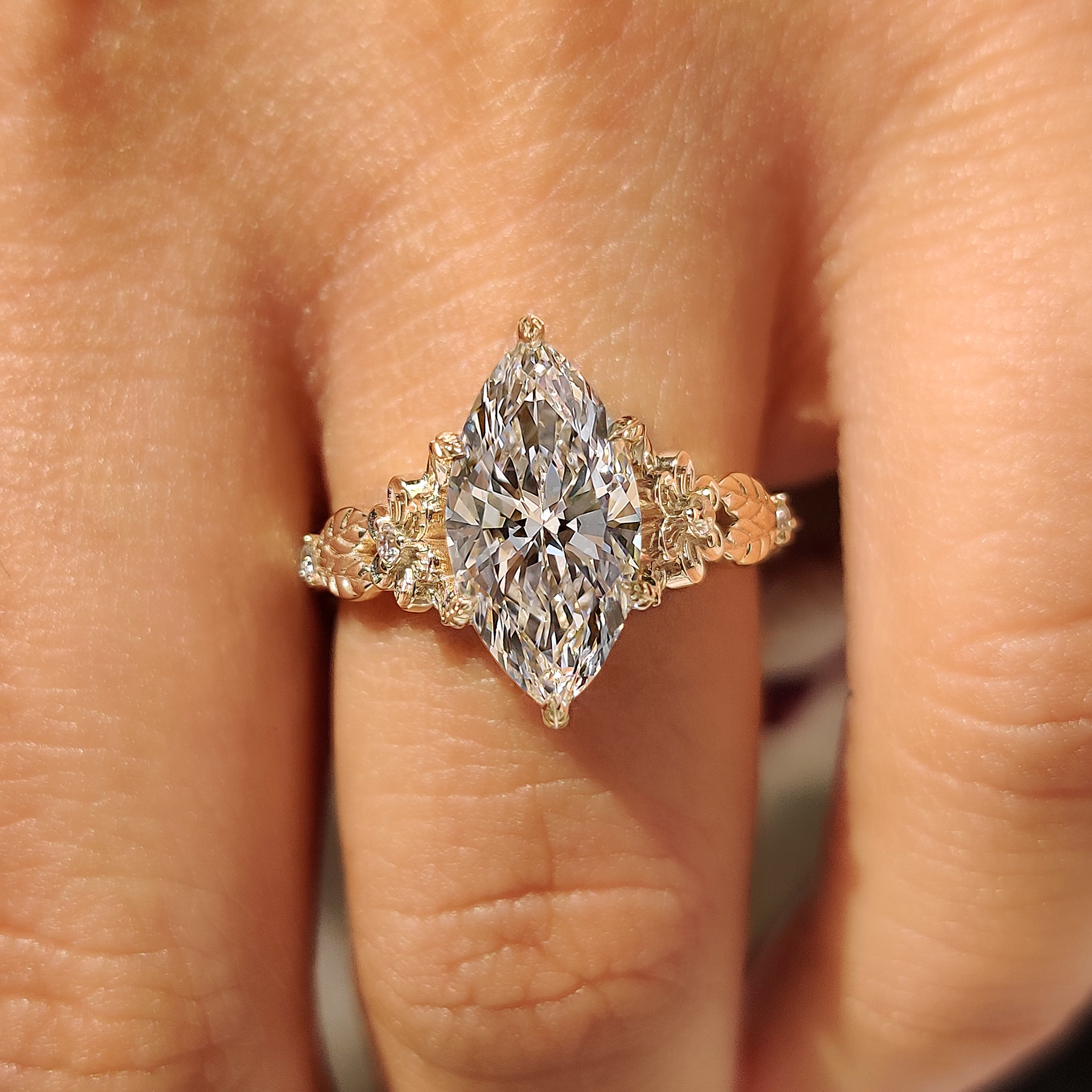 Vintage style marquise diamond ring with leaf prong setting
