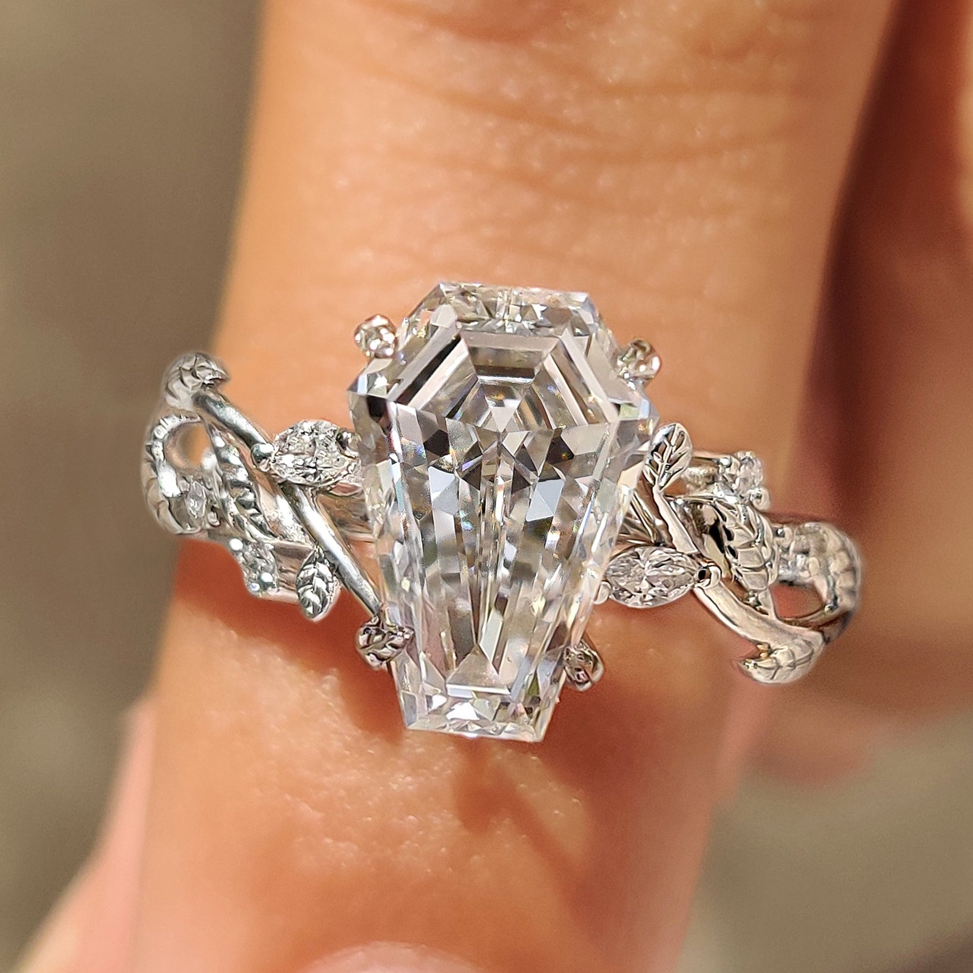 Coffin cut lab grown diamond ring with cluster setting.
