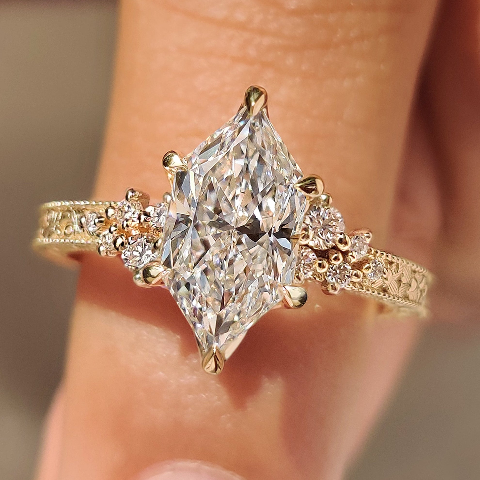 Dutch marquise diamond ring with round side stones accents
