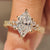 Dutch marquise diamond ring with round side stones accents
