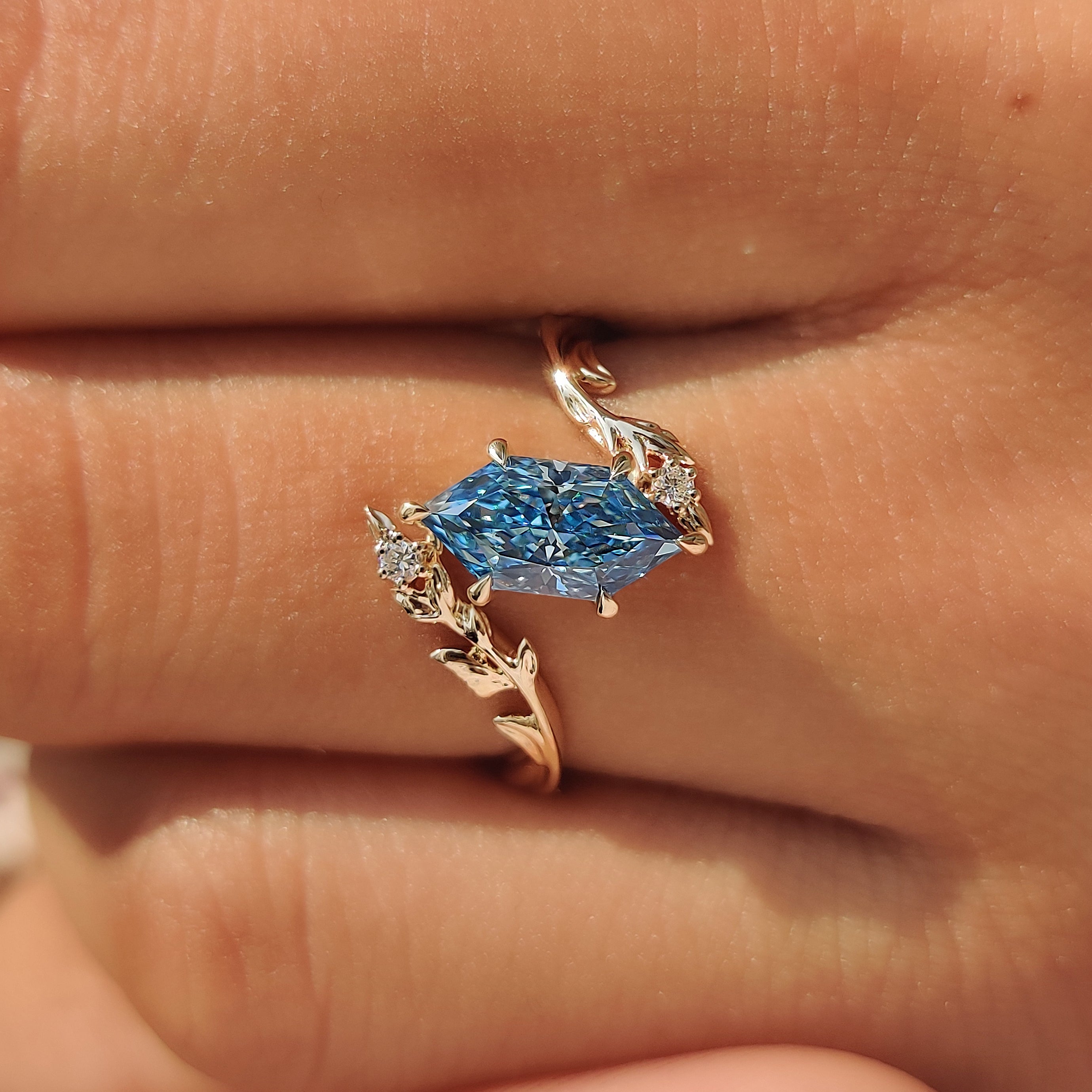 Yellow gold Dutch marquise ring with twisting vine shank.
