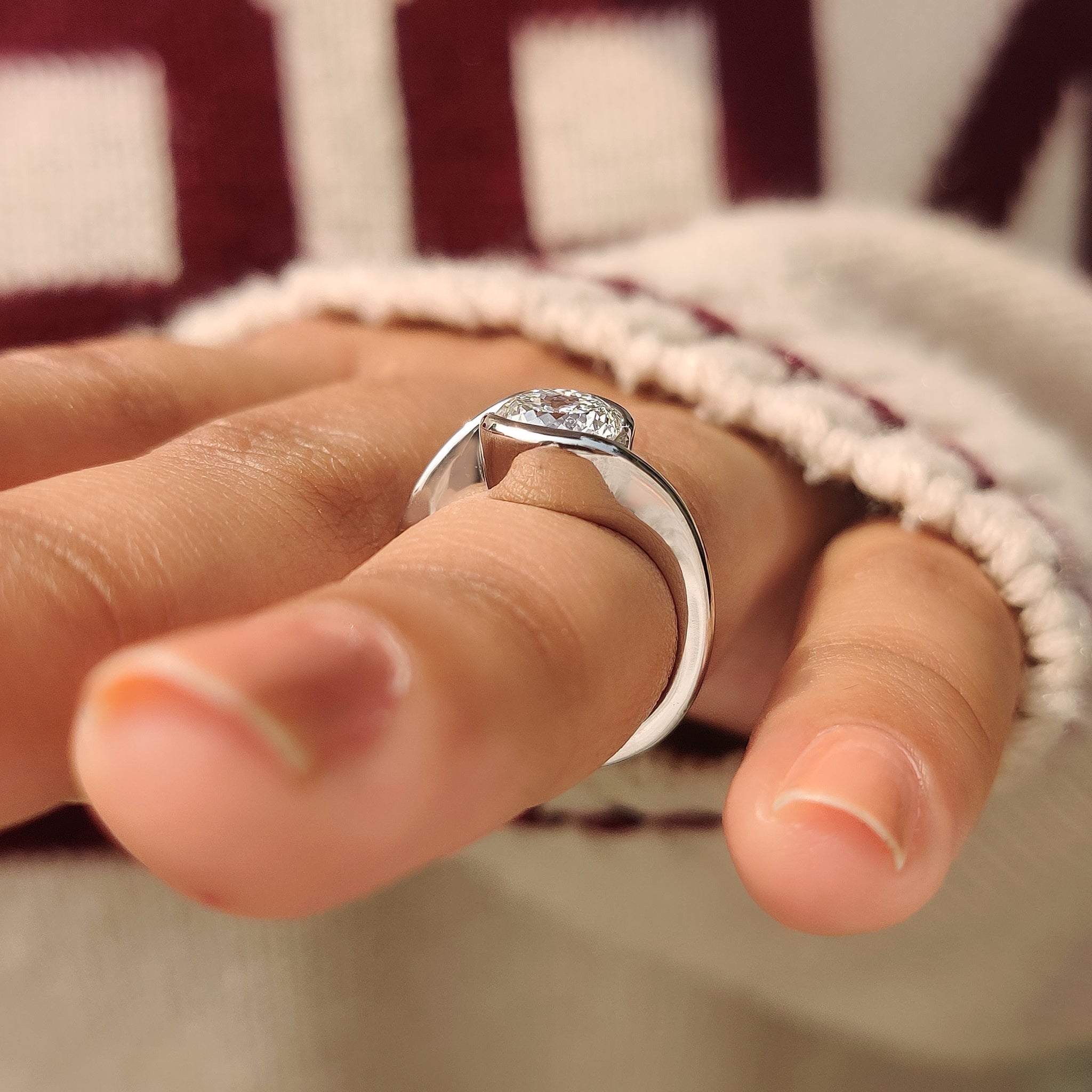 Solitaire Portuguese diamond ring with modern half bezel setting.

