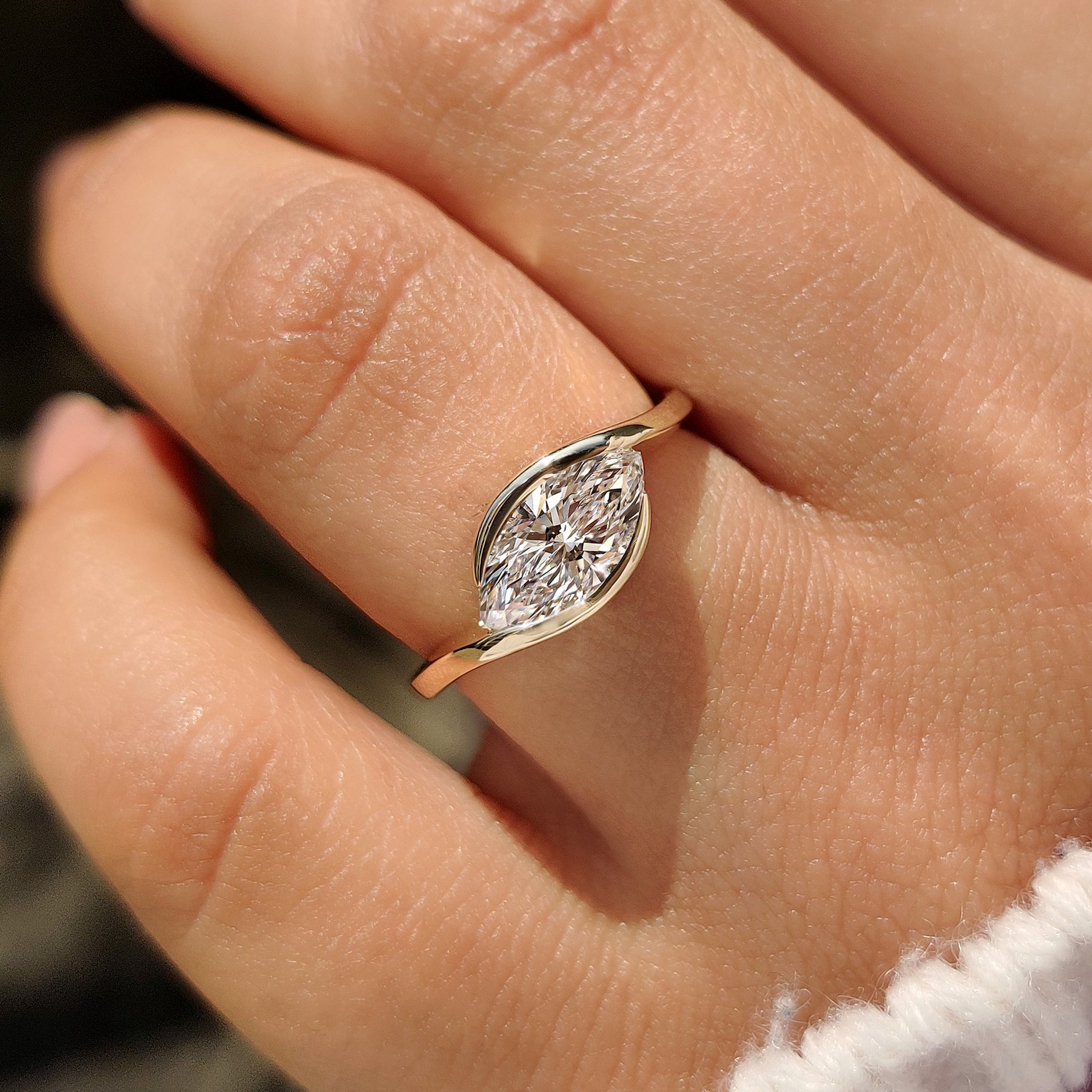 Bypass ring with marquise center diamond
