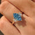 Blue Dutch marquise diamond in three stone ring design.
