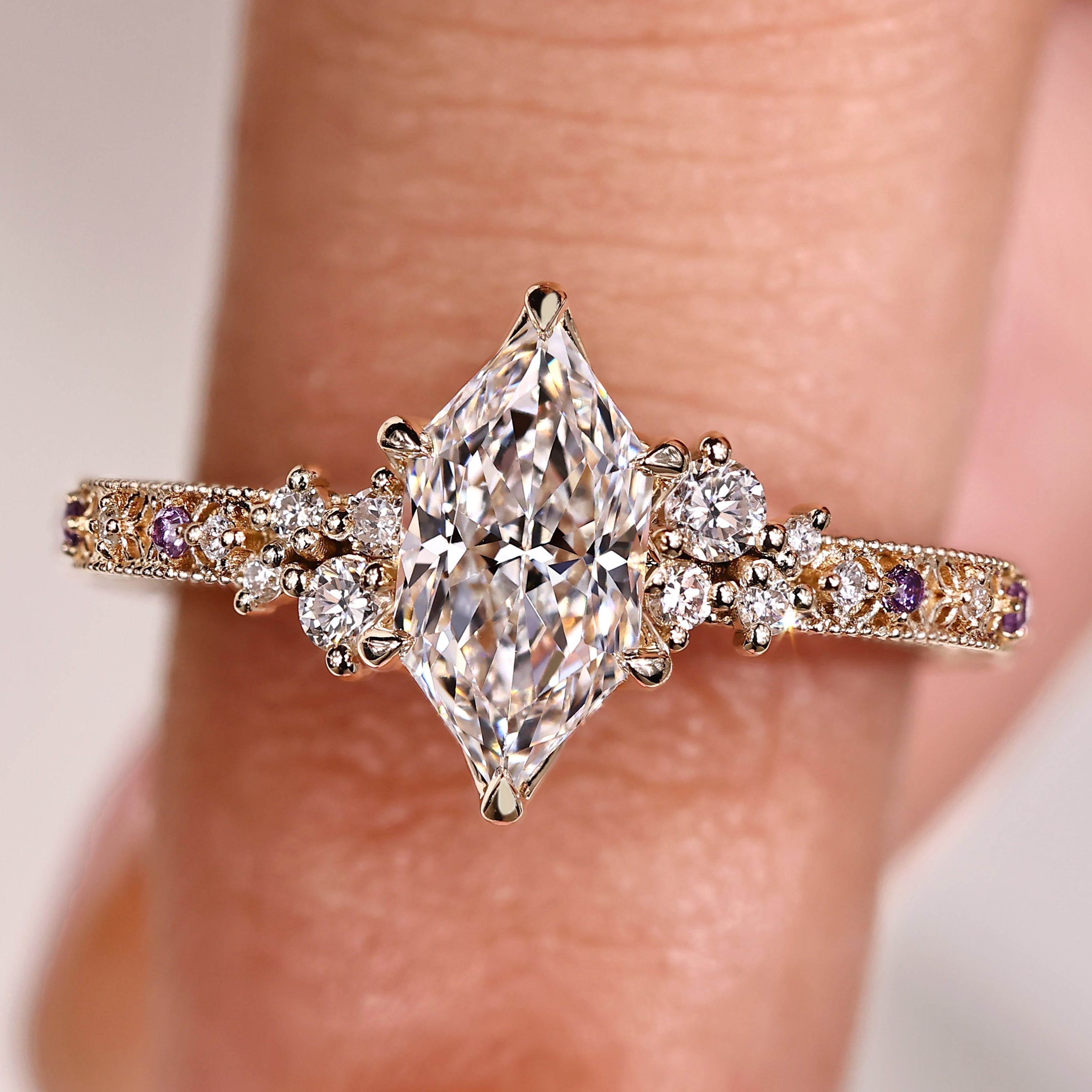 Dutch marquise center diamond with round side stones and tulip setting
