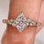 Dutch marquise center diamond with round side stones and tulip setting
