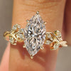 Marquise diamond ring with hidden leaf gallery.
