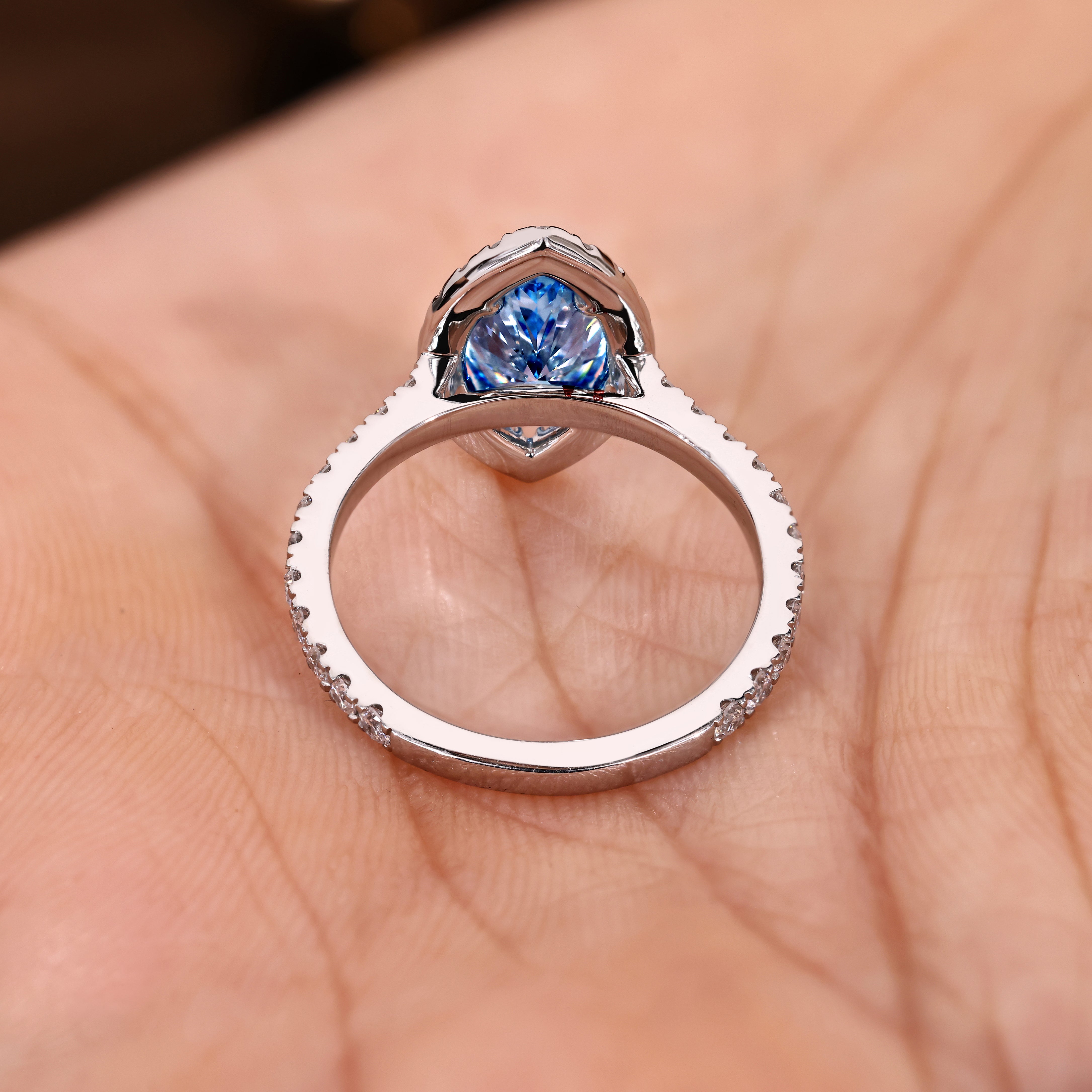 Lab grown marquise ring with round diamond halo setting
