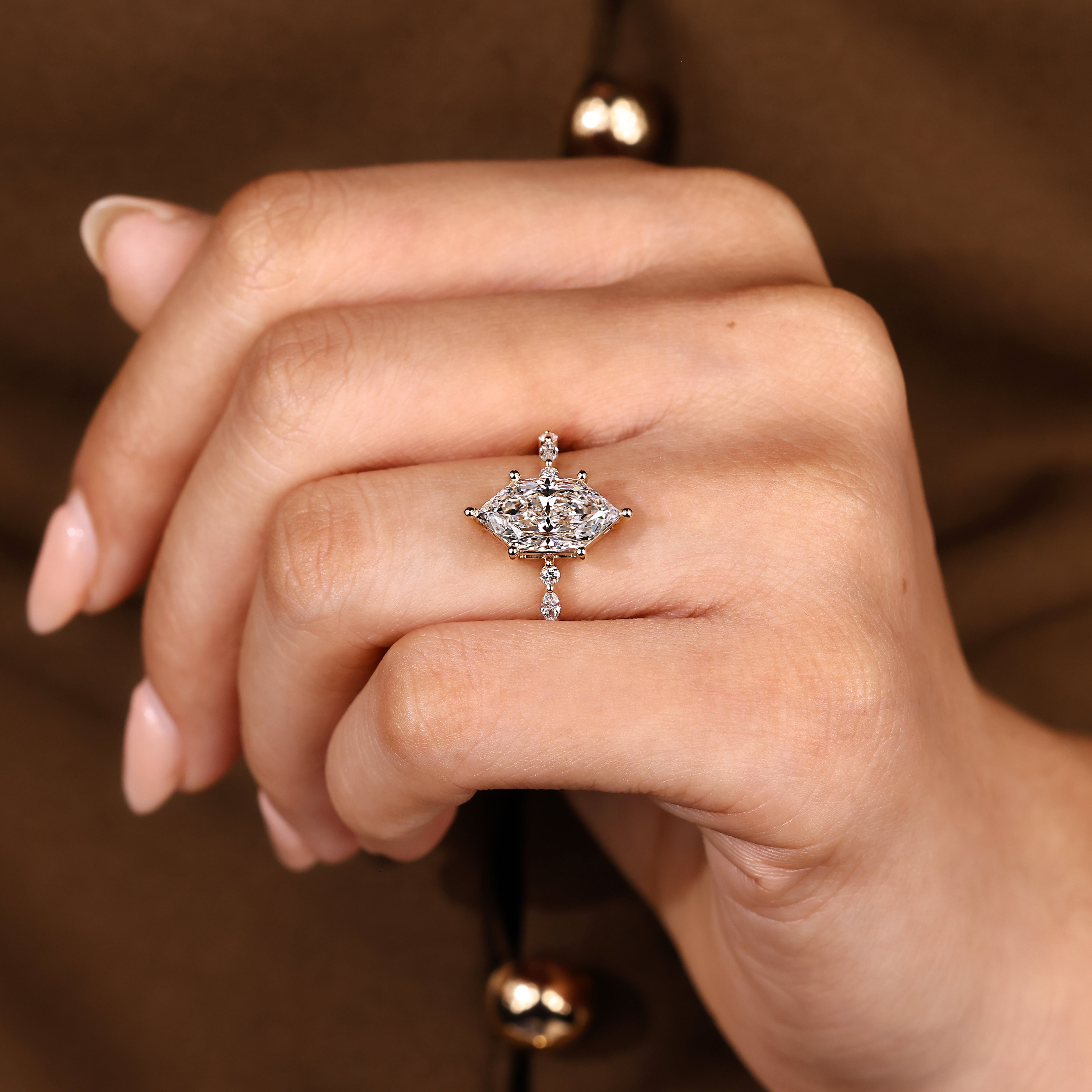 Handmade marquise engagement ring with pave and side stones

