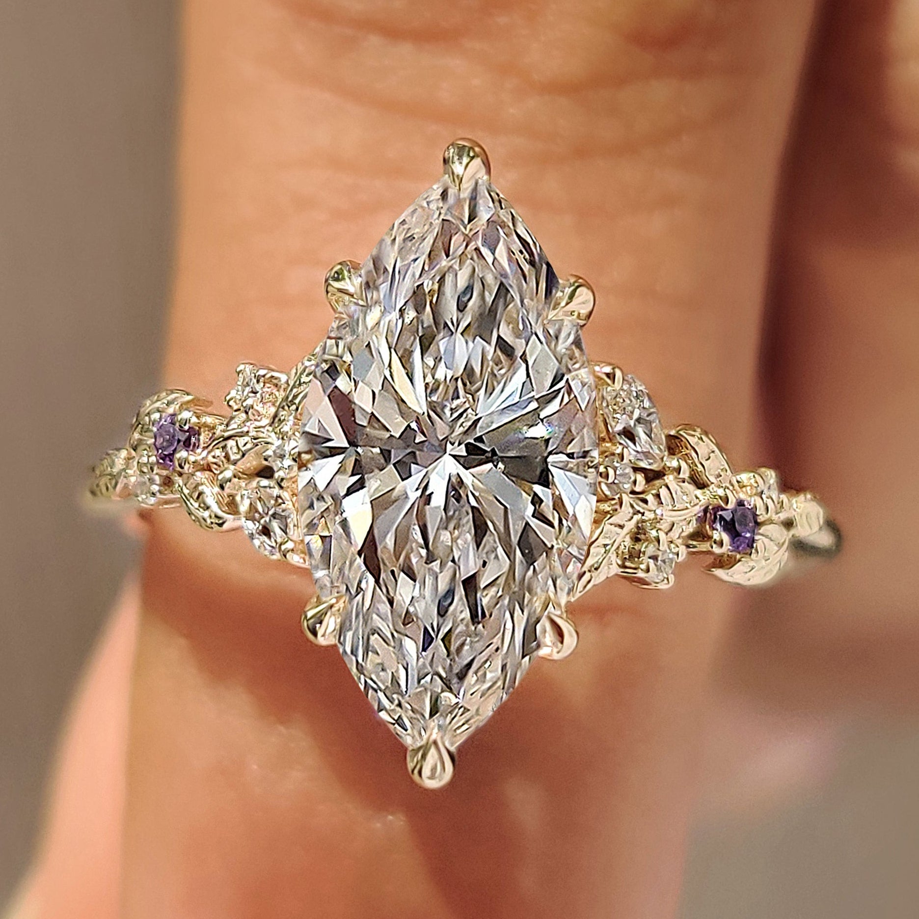 Marquise diamond ring with marquise and round amethyst side stones
