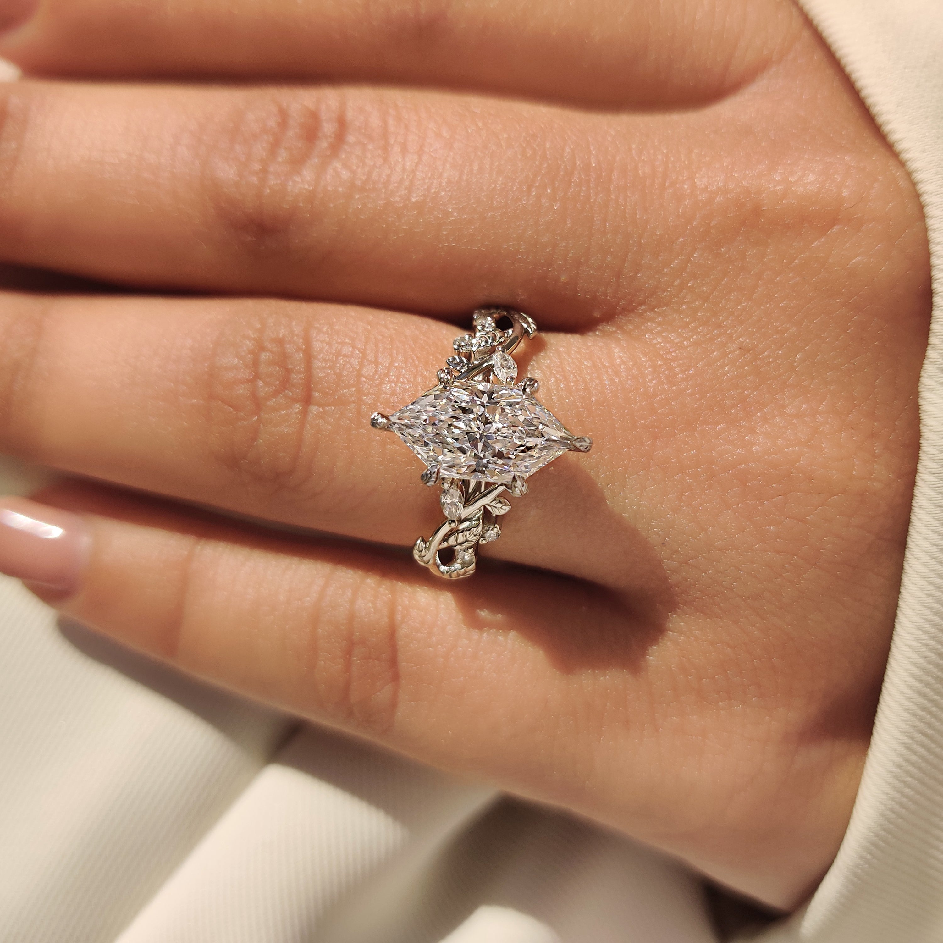 Marquise and round side stone engagement diamond ring.
