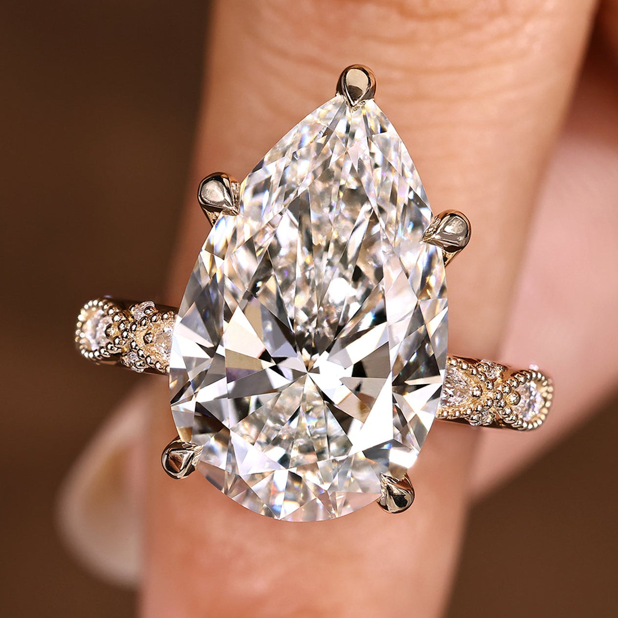 Pear shaped diamond ring with 10 carat pear cut center diamond
