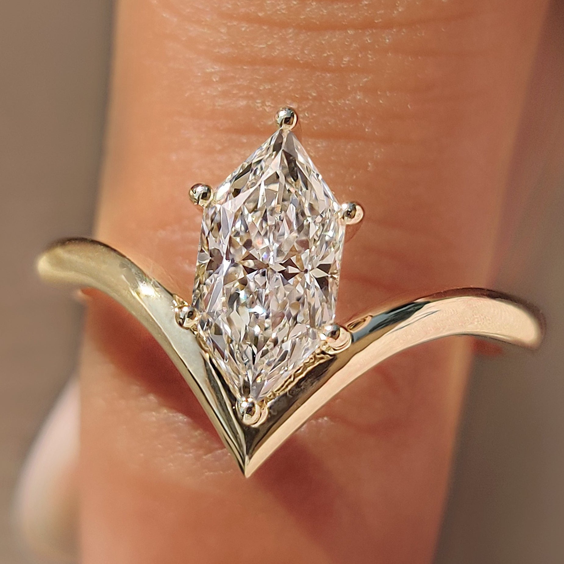 Dutch marquise solitaire engagement ring in yellow gold.
