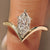 Dutch marquise solitaire engagement ring in yellow gold.
