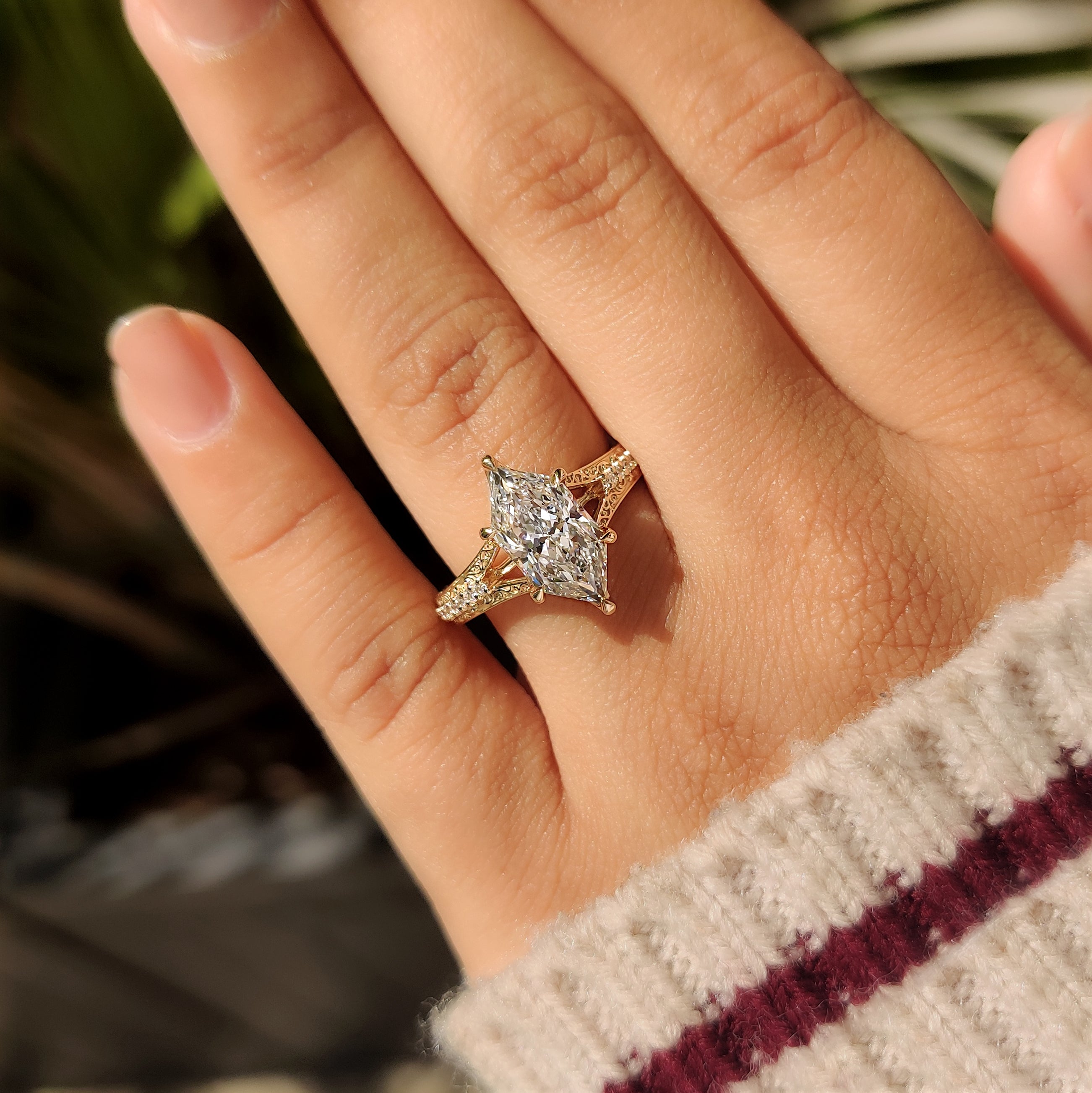 Marquise diamond ring with milgrain details and pave band
