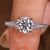 Round diamond engagement ring with milgrain detailing
