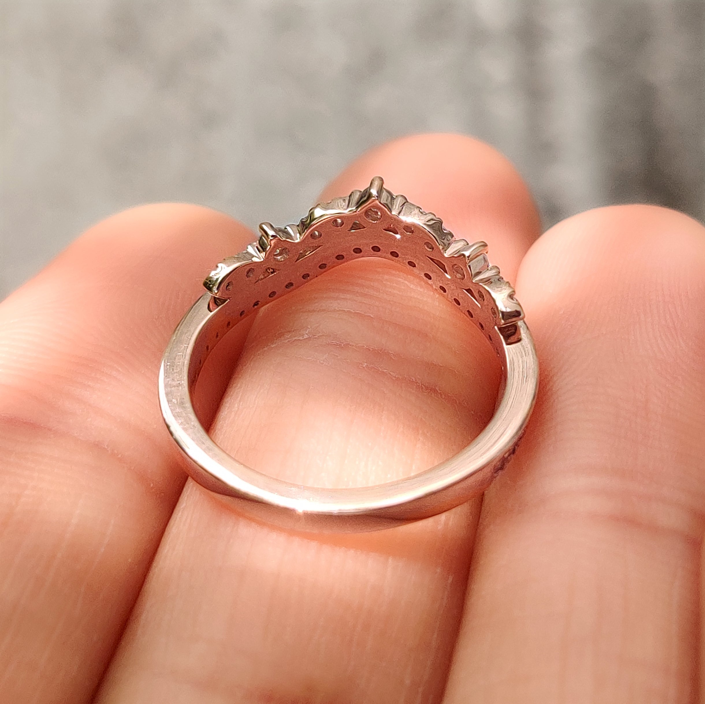 Round cut diamond tiara band with pink diamond accents
