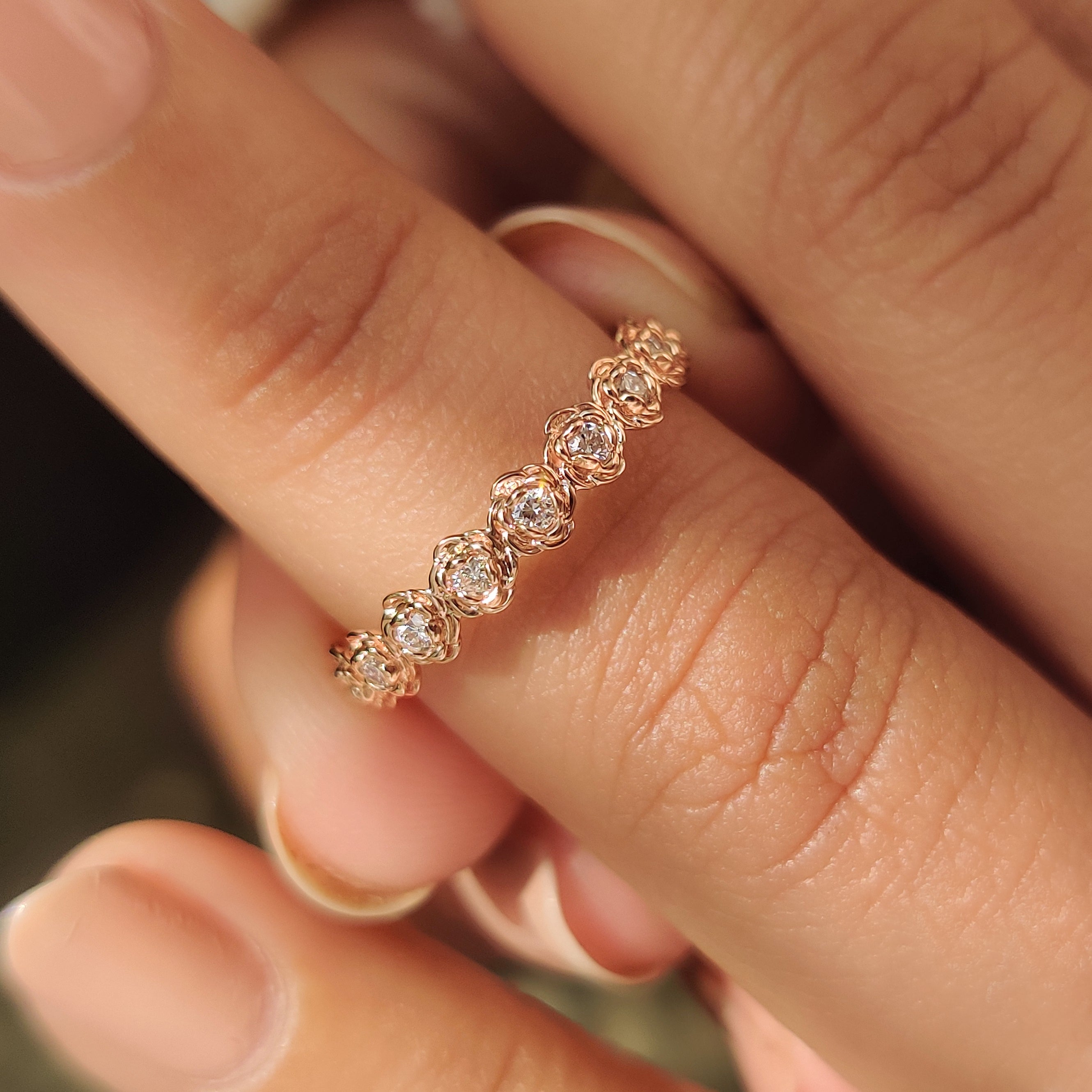 Handmade nature inspired band with round diamond flower details.

