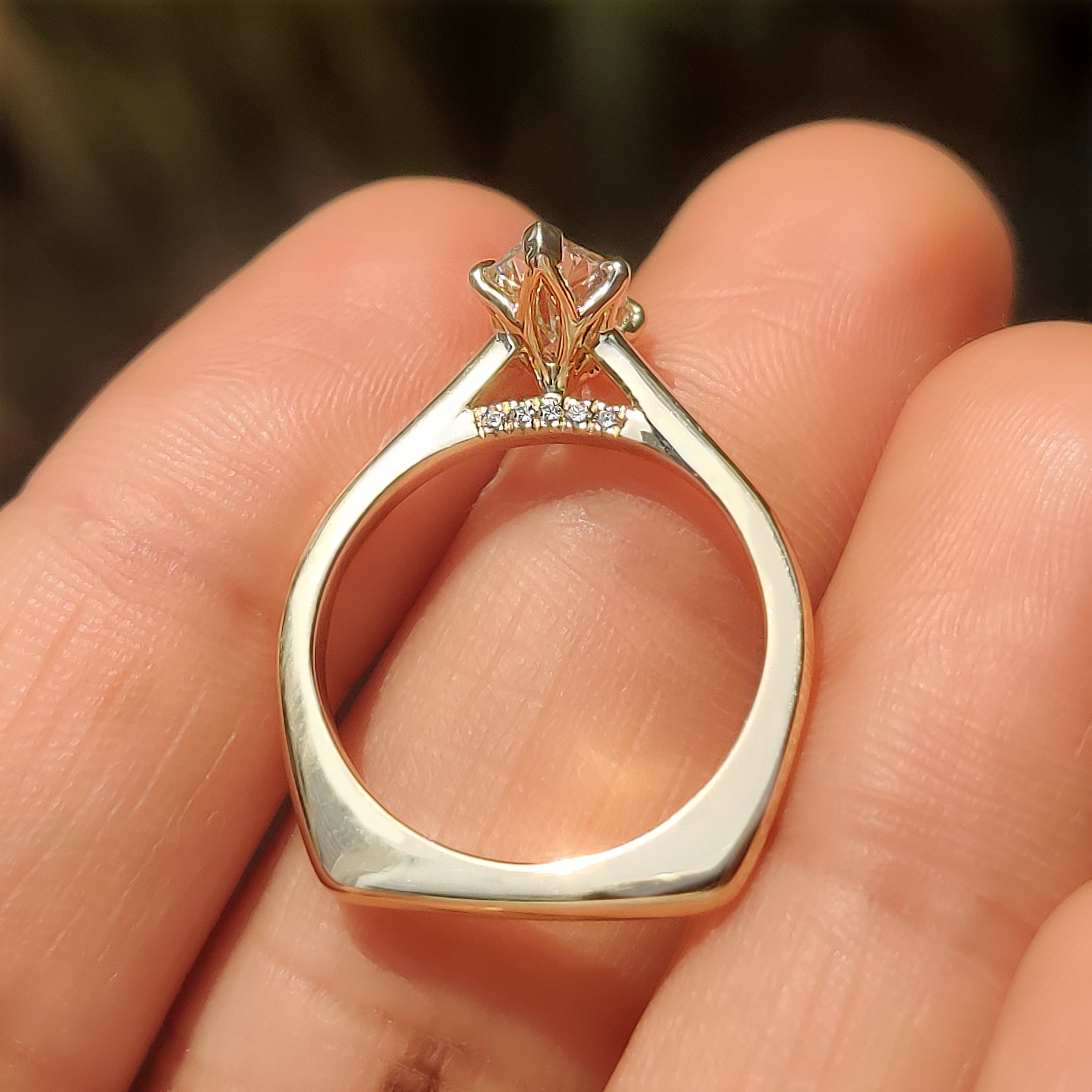 Dutch marquise ring with six claw prongs and accents
