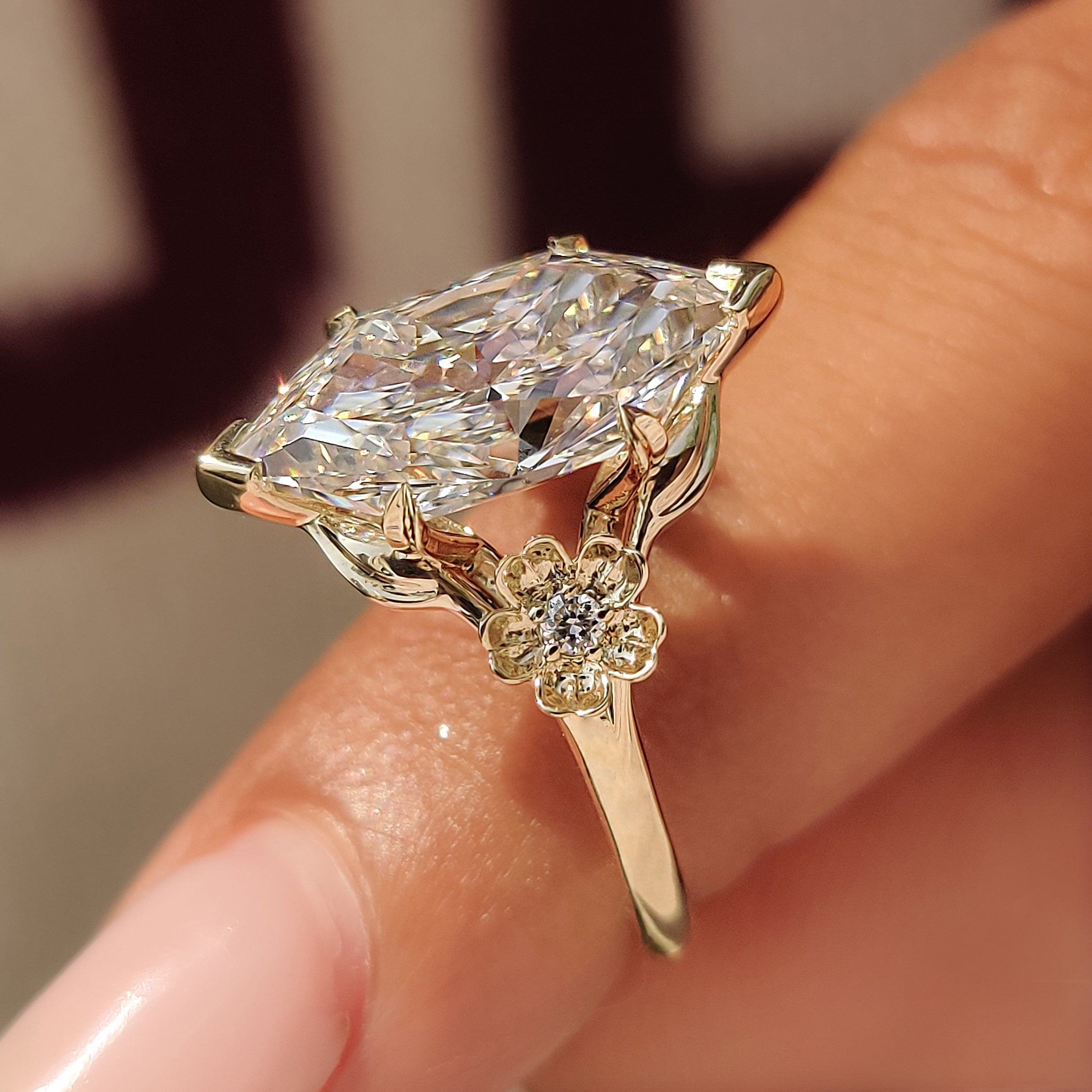 Floral Dutch marquise ring with botanical metalwork.
