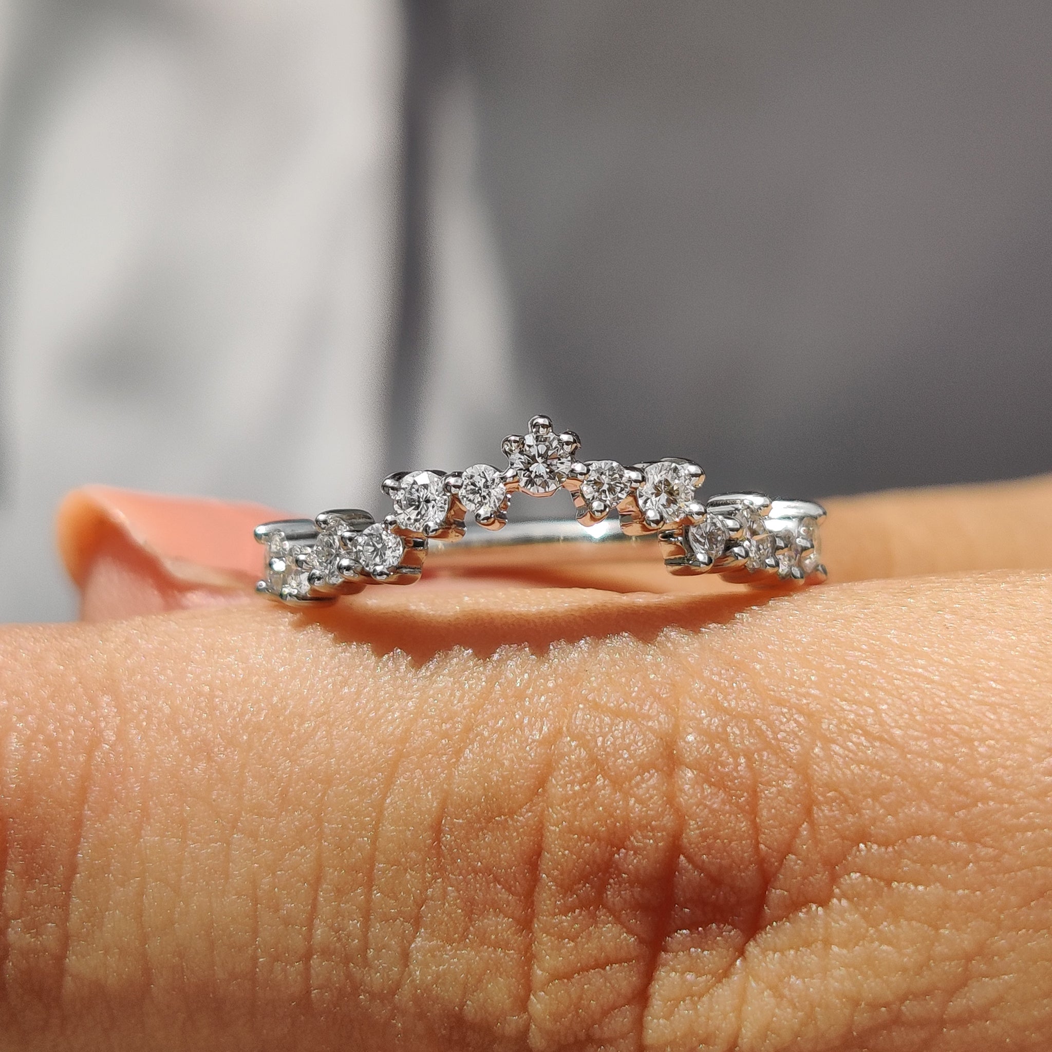 Curved diamond band with a smooth white gold finish.
