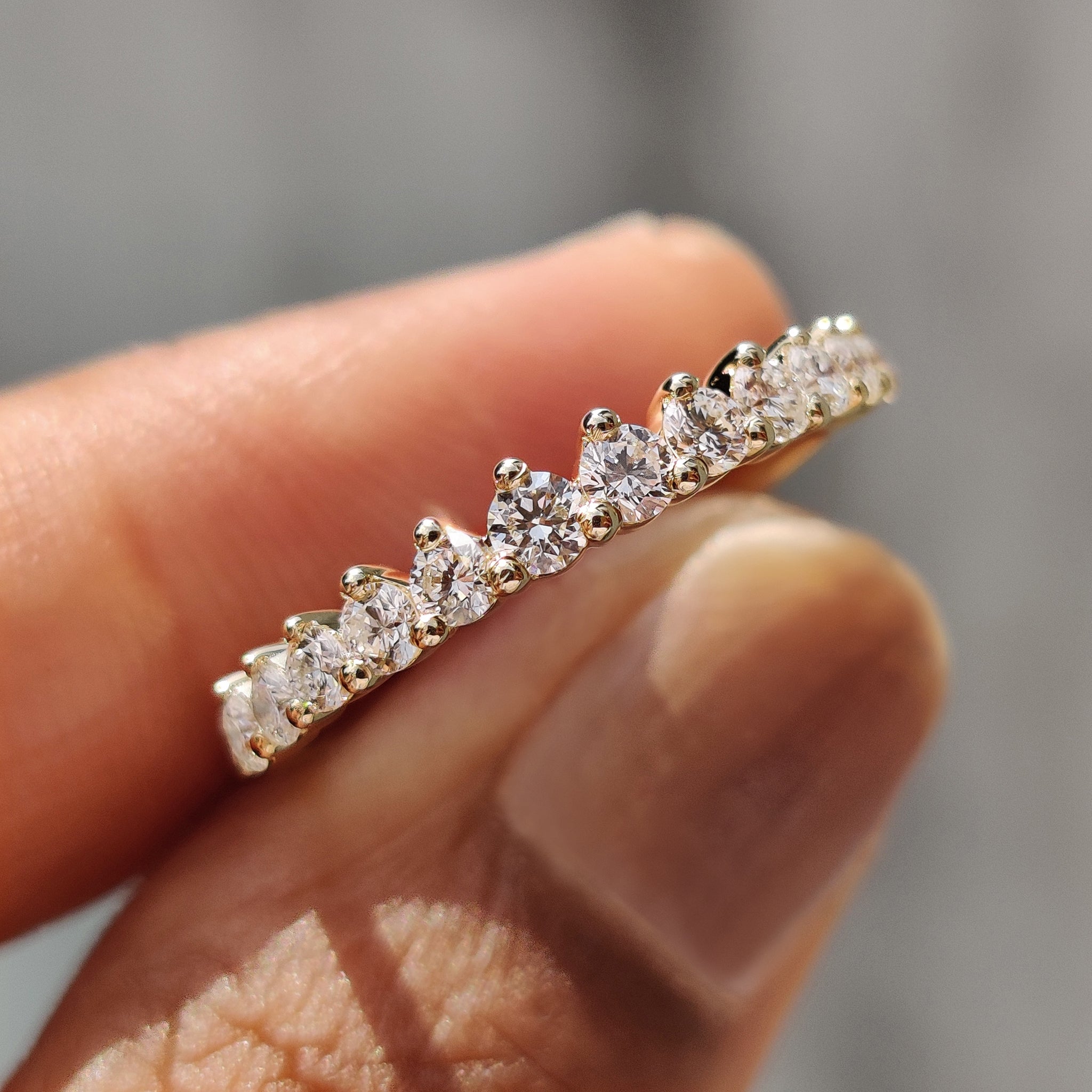 Half eternity diamond band with sparkling round diamonds.
