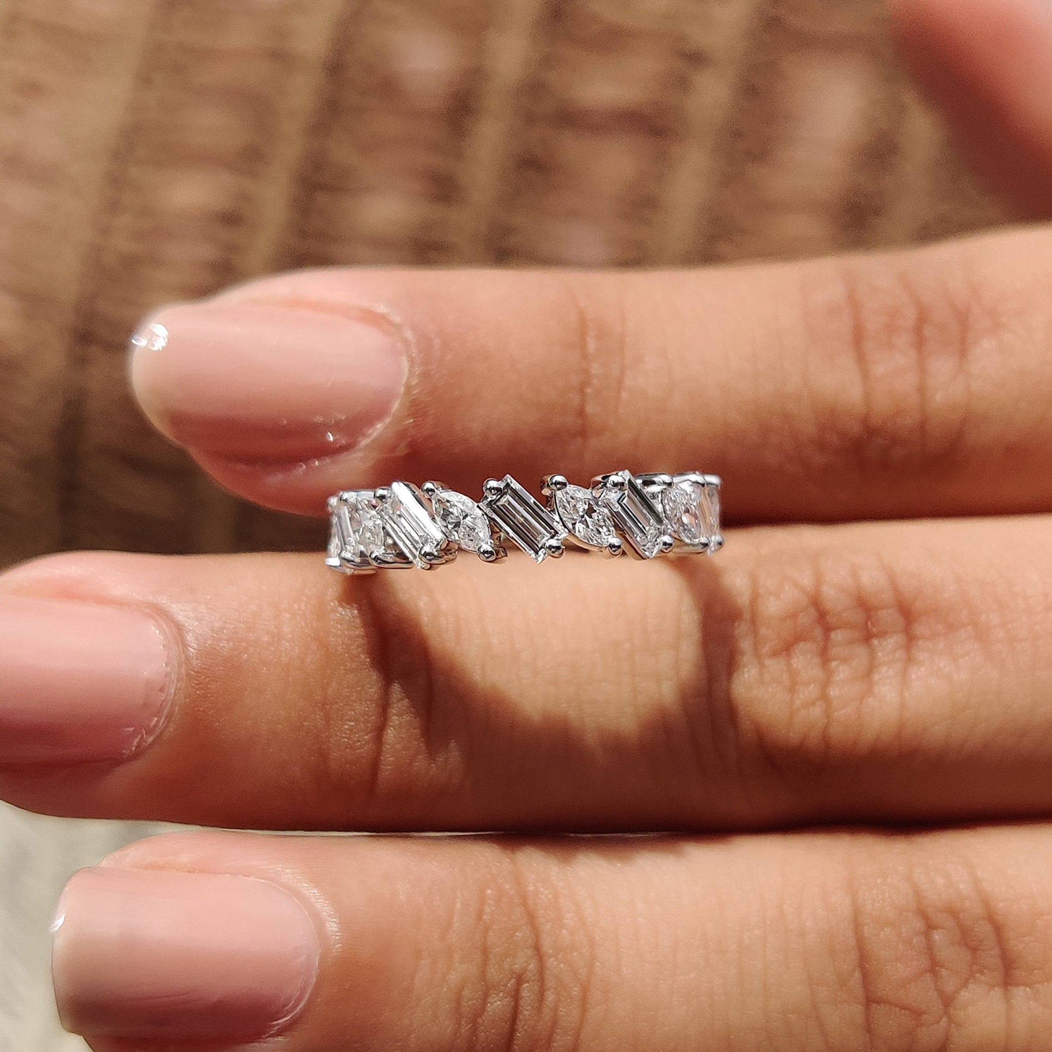 Elegant white gold diamond band with a sophisticated design.
