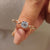 Round solitaire engagement ring with a classic solitaire setting in rose gold.

