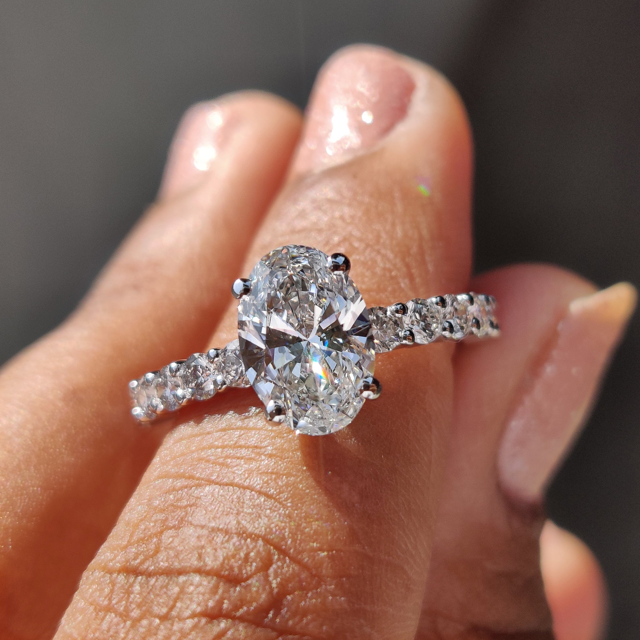 Oval pave engagement ring featuring a brilliant design.
