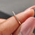 Minimalist wedding band in yellow gold with a sleek finish.
