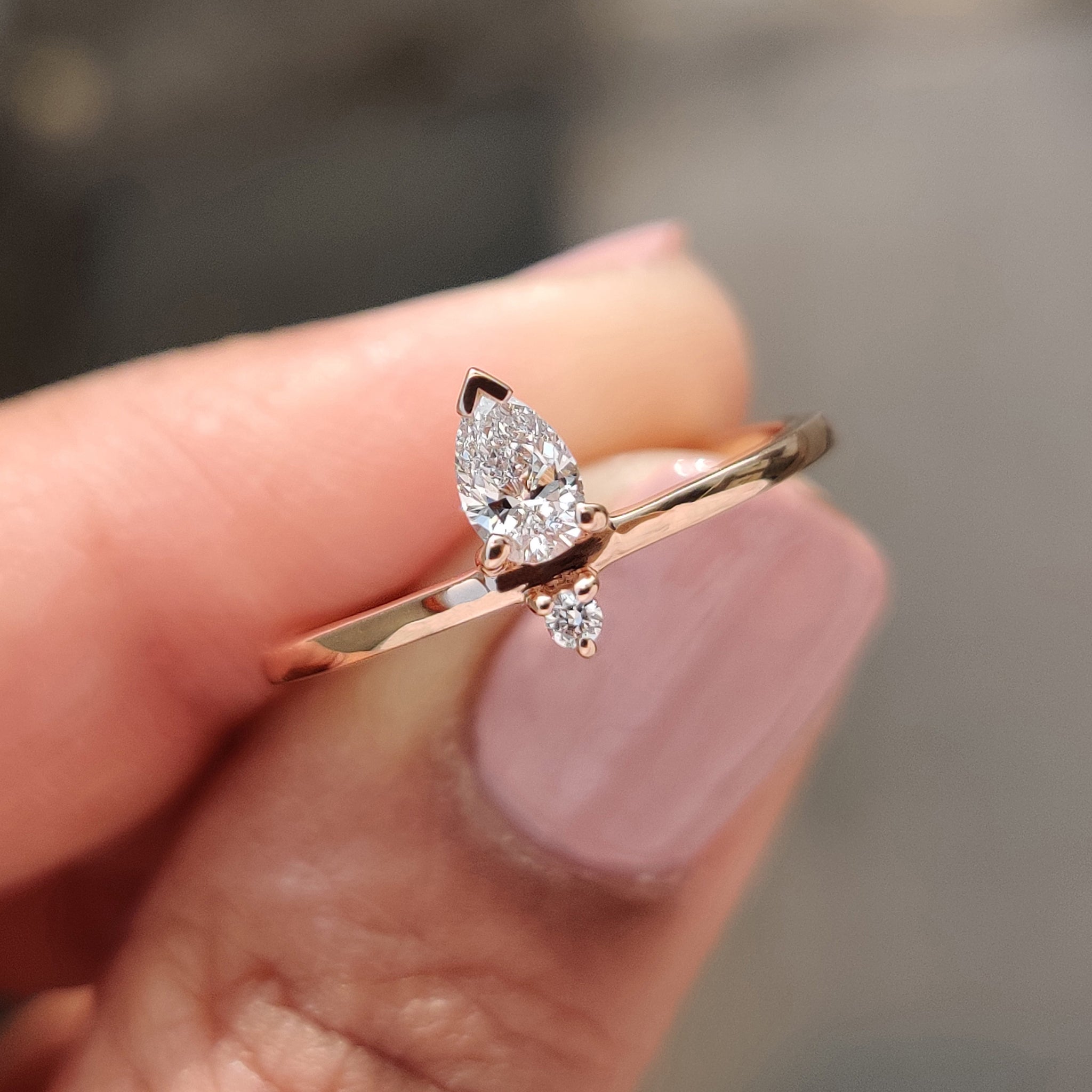 2 stone engagement ring with pear and round cuts.