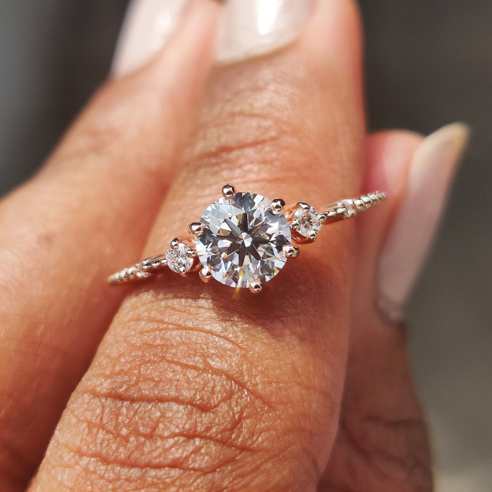 3 stone diamond ring with a sparkling design.