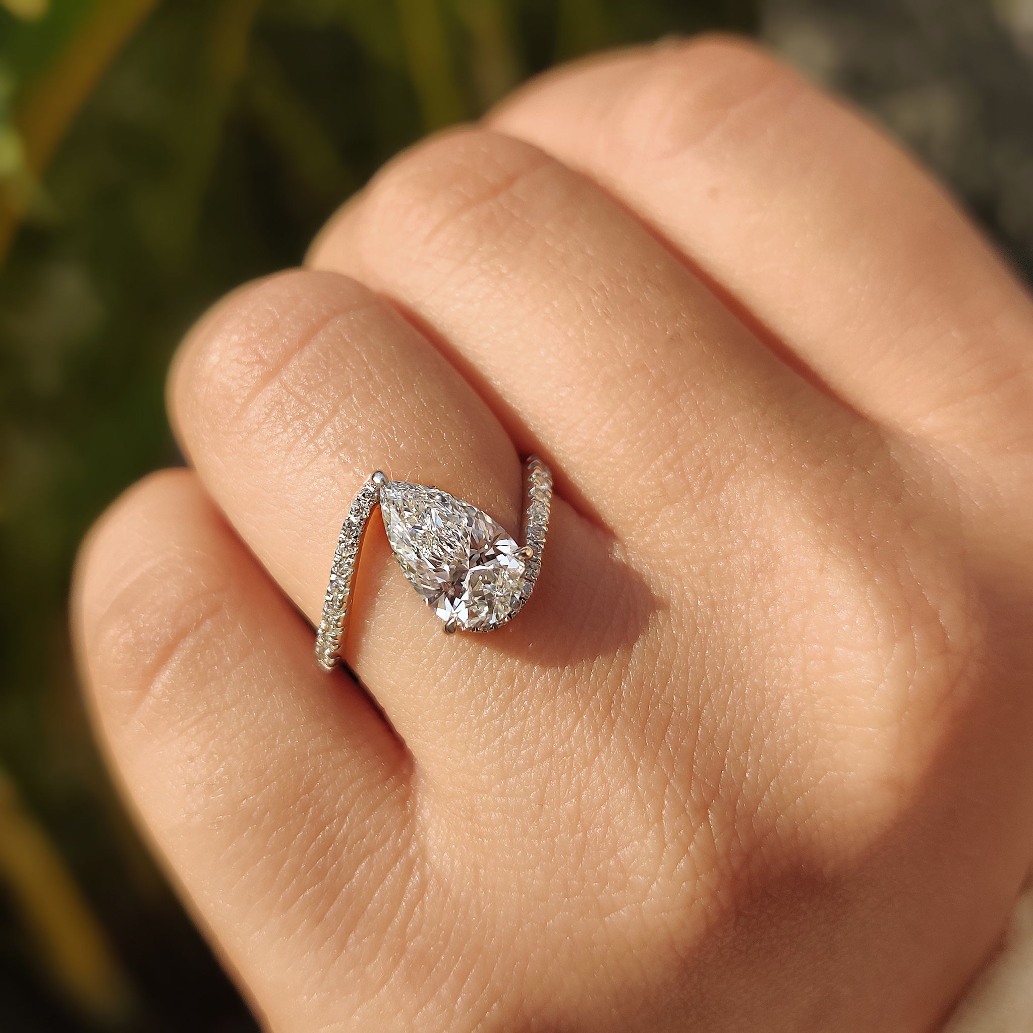 Pear bypass ring with a unique design.
