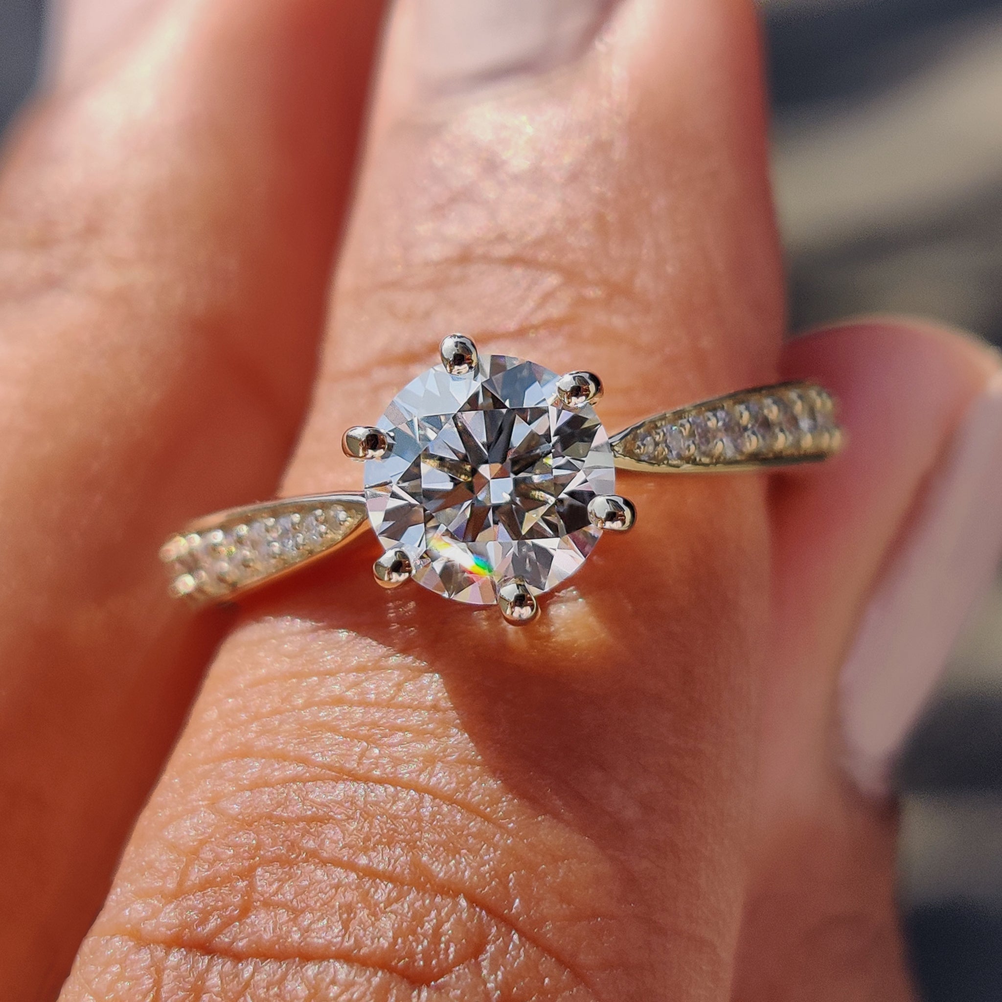 Round cut engagement ring with a sparkling diamond center.
