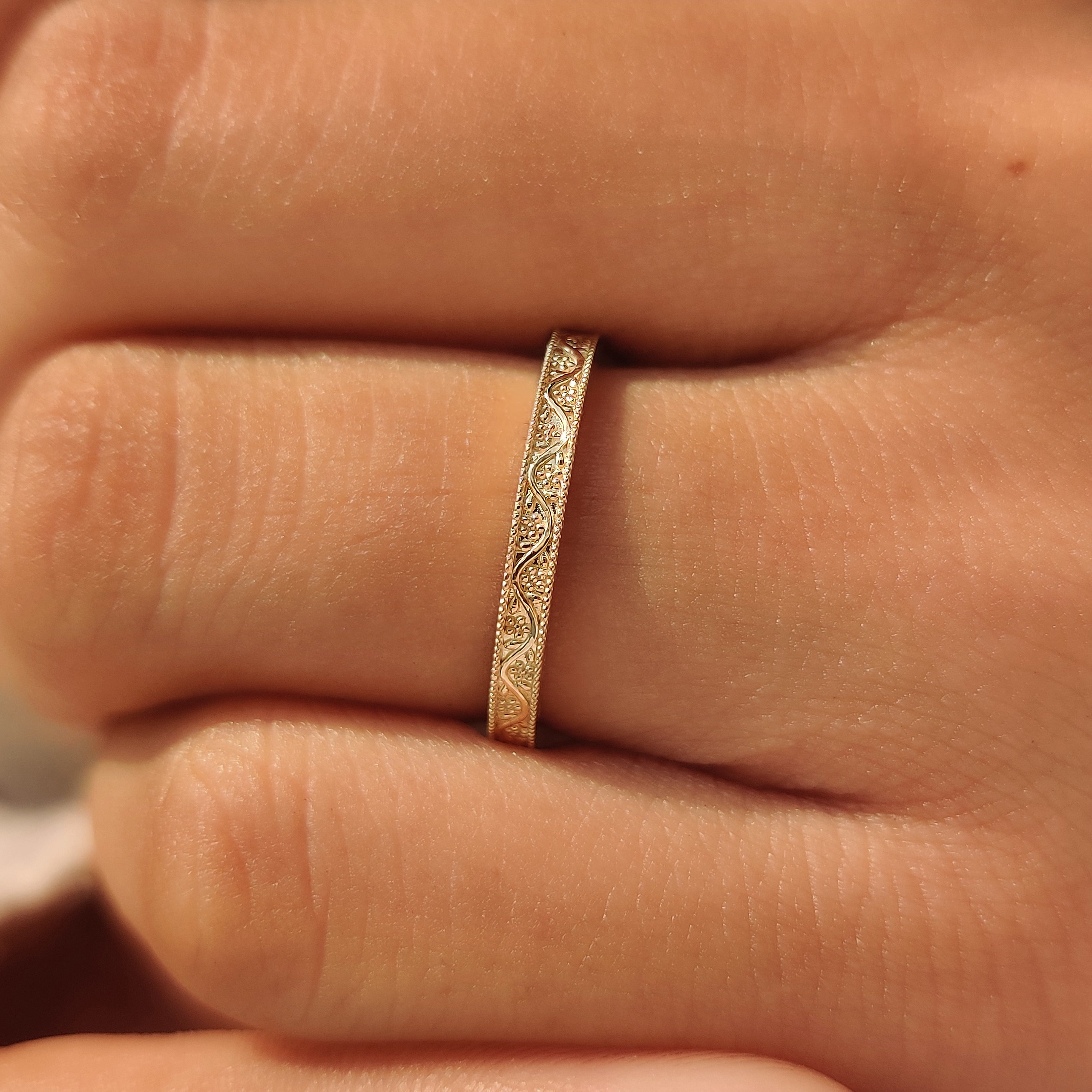 Vintage inspired band with hand engraved detailing.
