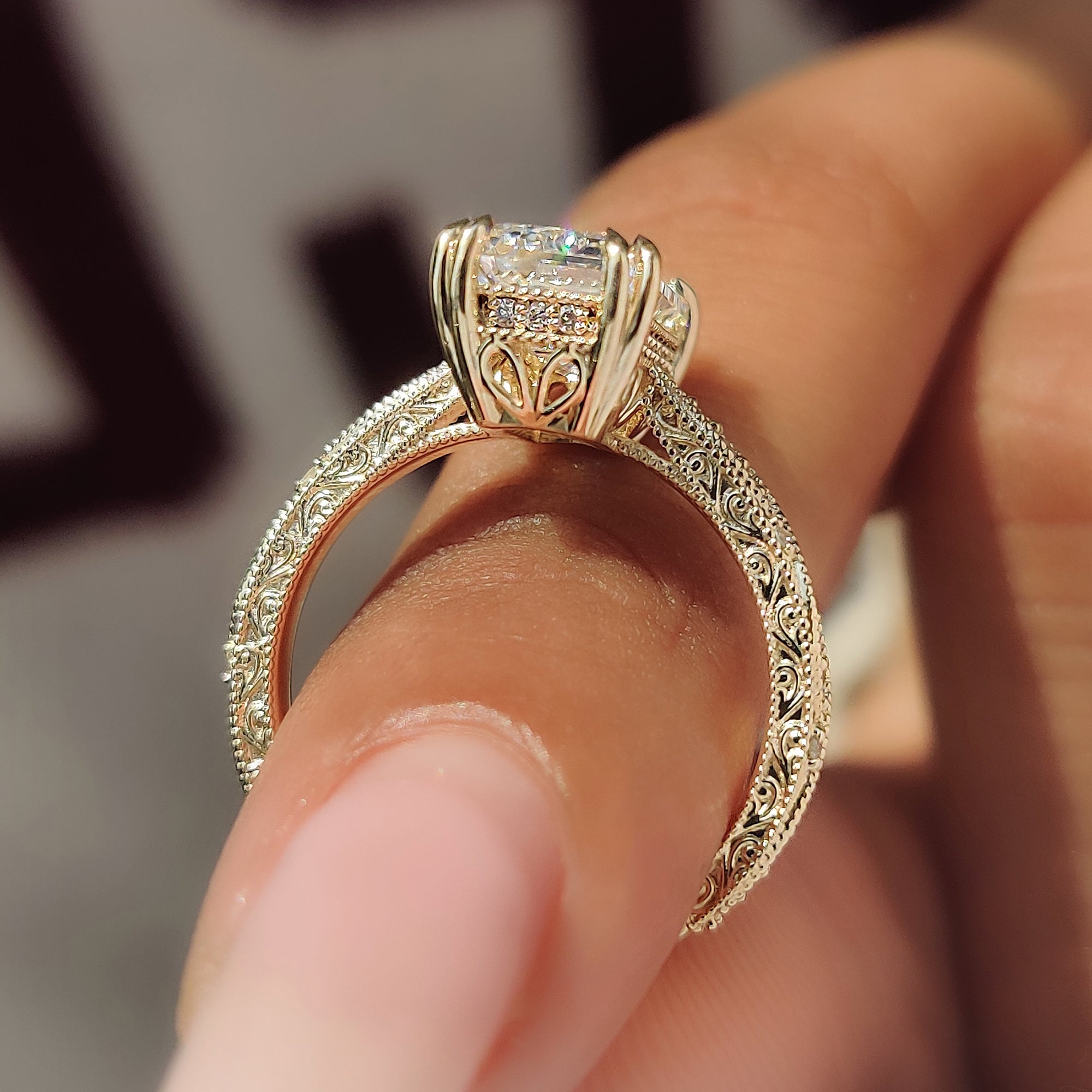 Yellow gold emerald cut ring with hidden halo.
