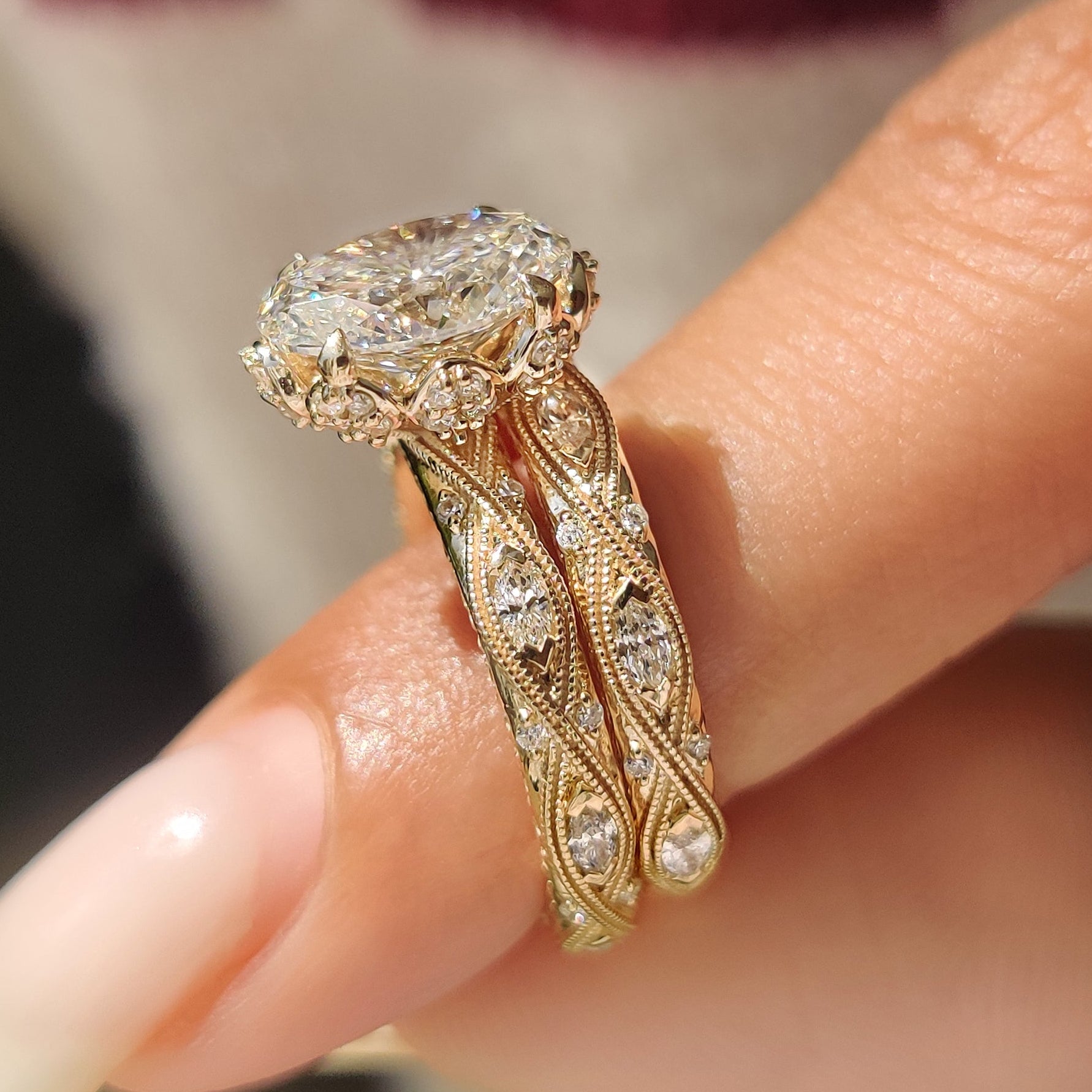 Vintage oval engagement ring with eternity band and milgrain edges.
