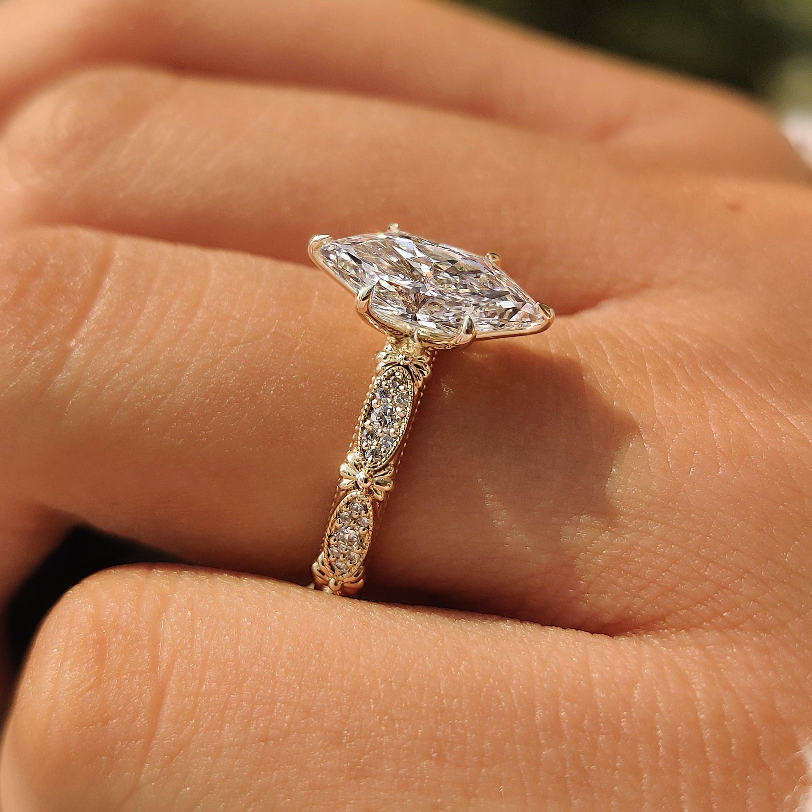 Round accent diamonds on a vintage Dutch marquise ring.

